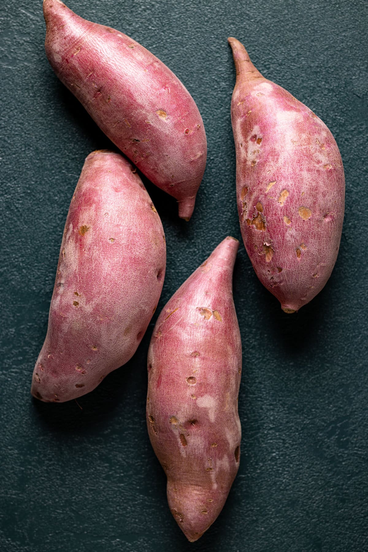 Four sweet potatoes