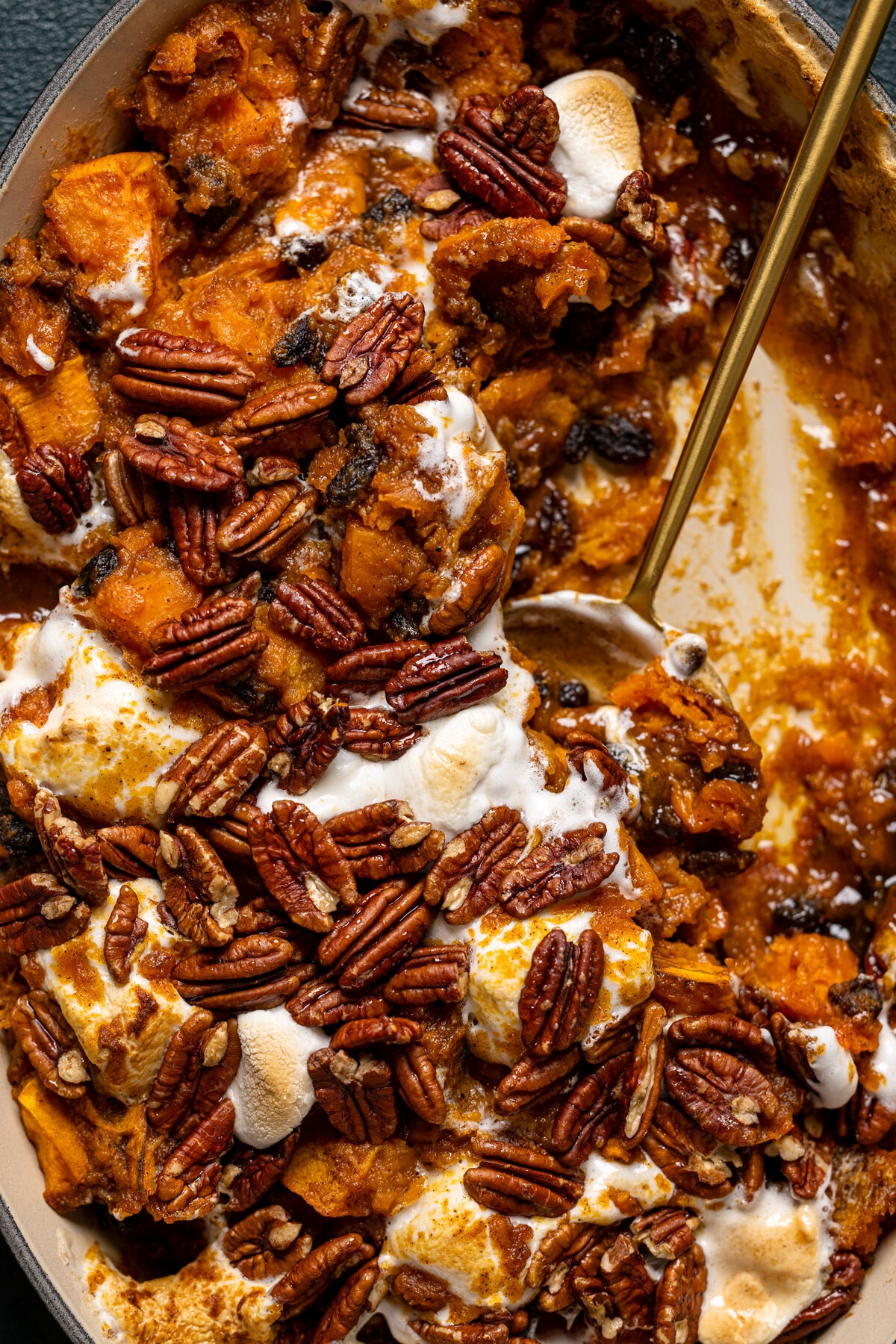 Spoon scooping Maple Sweet Potato Casserole