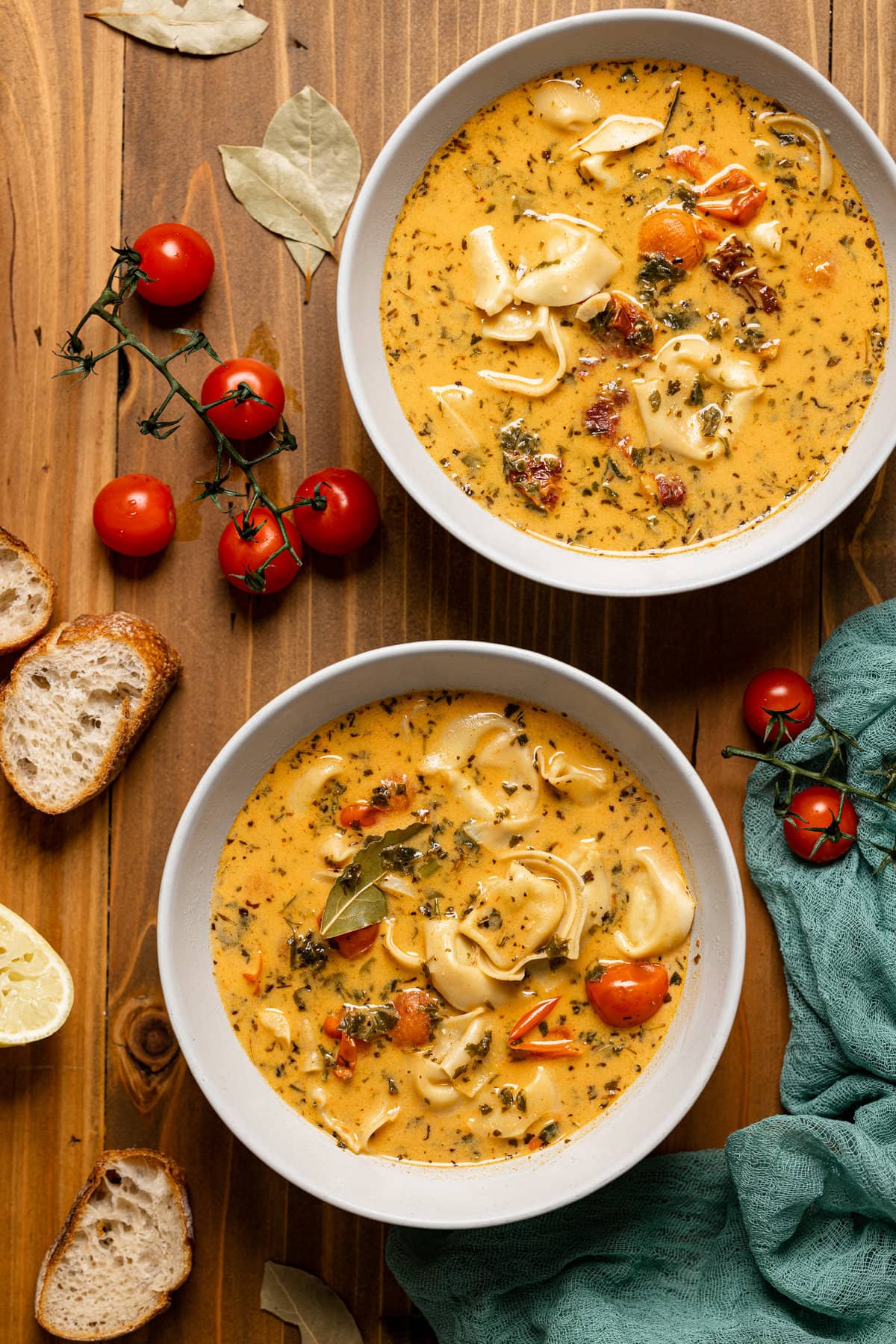 Overhead shot of two bowls of Creamy Tuscan Tortellini Soup