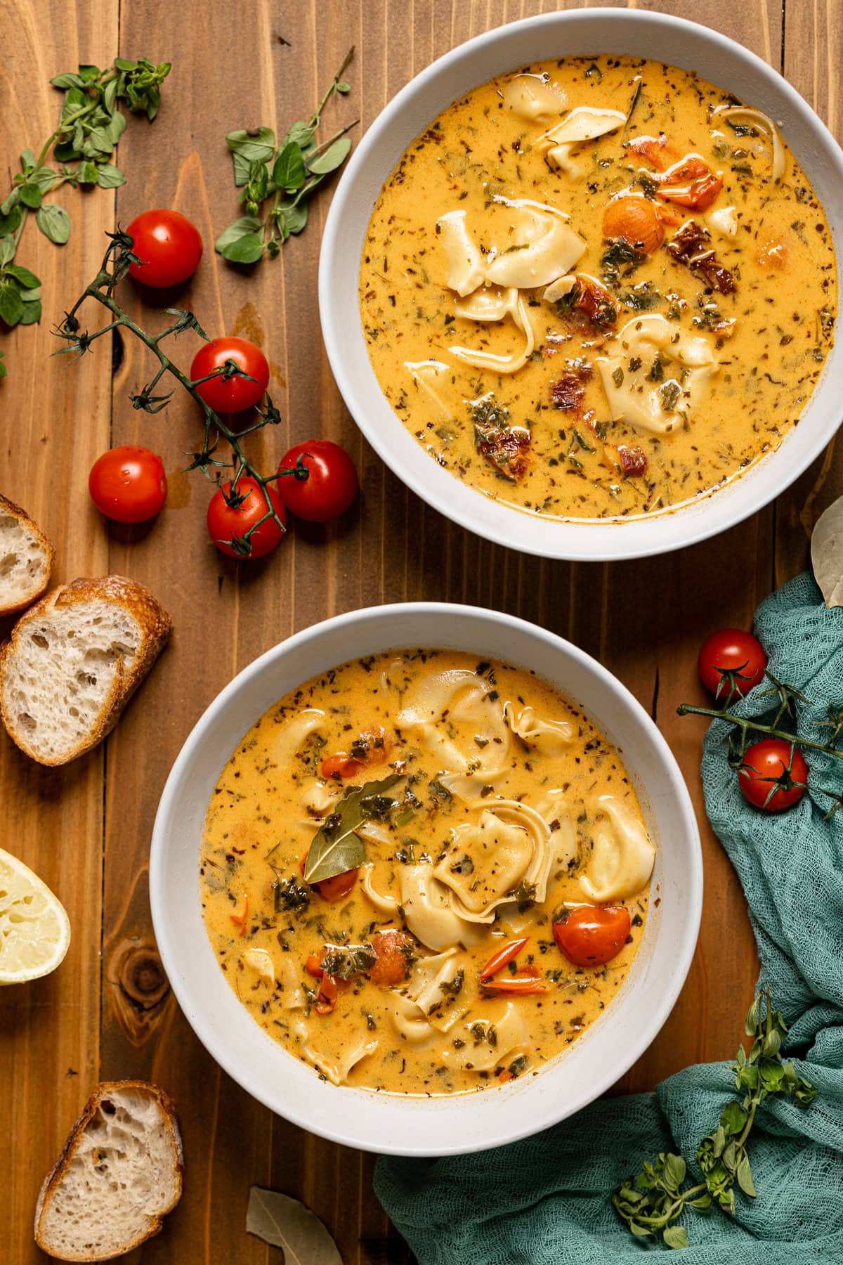 Overhead shot of two bowls of Creamy Tuscan Tortellini Soup