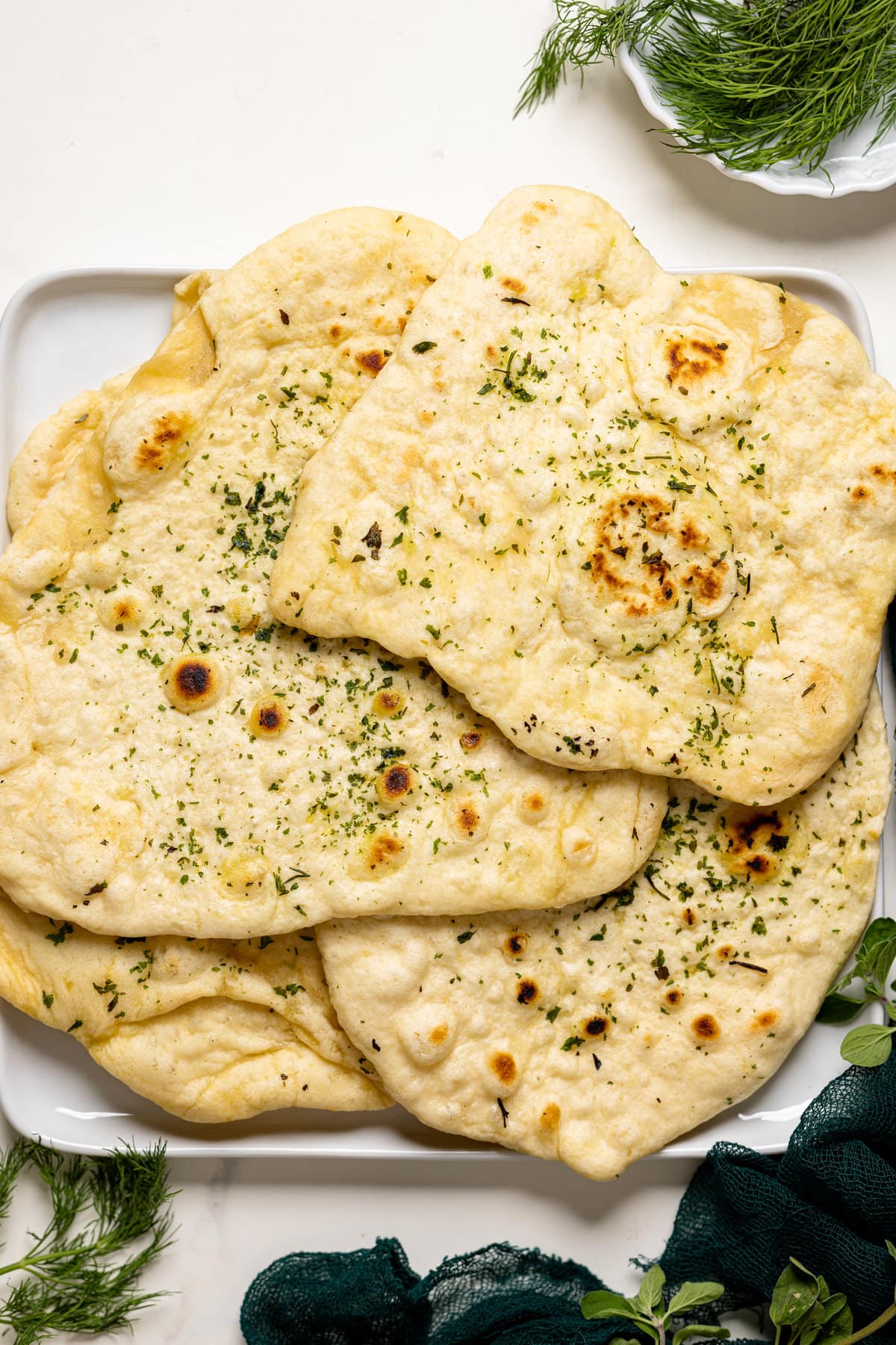 Pile of Vegan Garlic Naan Bread on a plate