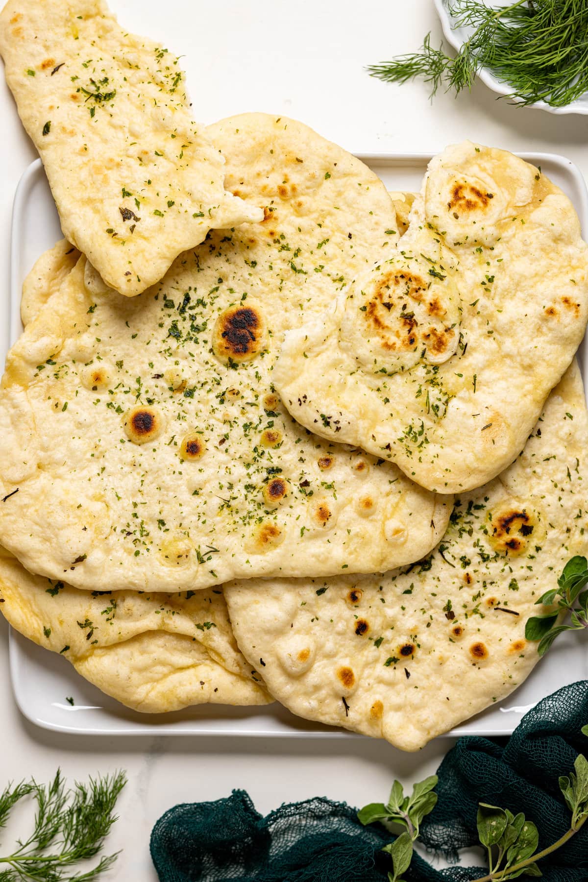 Pile of Vegan Garlic Naan Bread on a plate