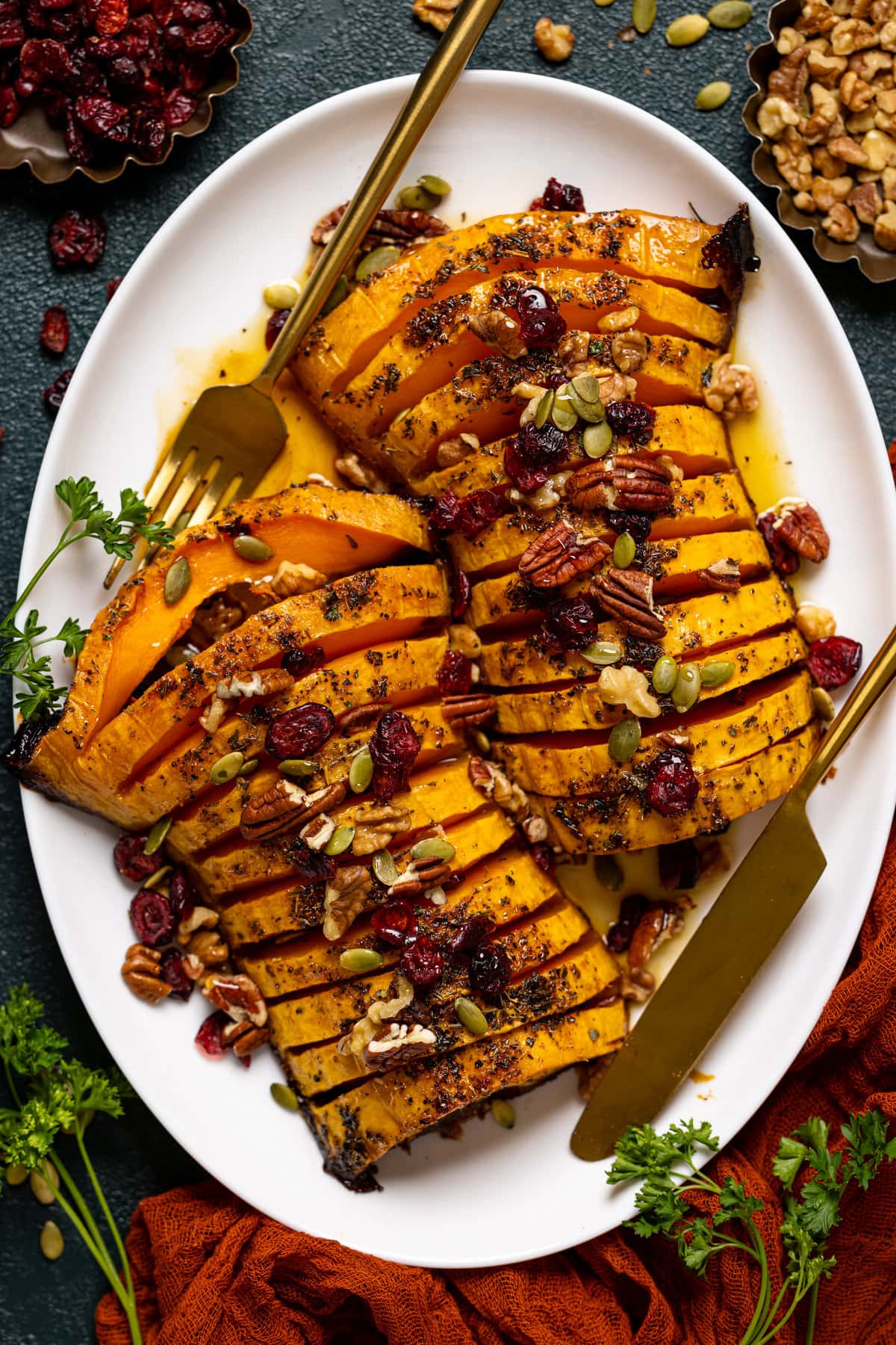 Overhead shot of a plate of Maple Herb Roasted Butternut Squash with utensils