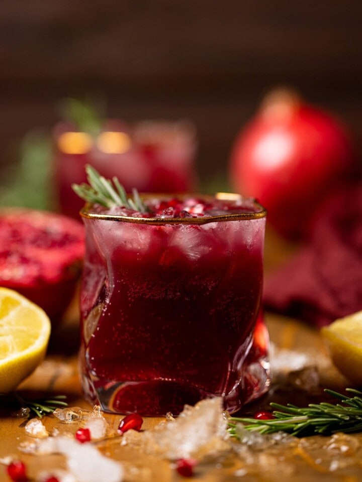 Holiday Pomegranate Ginger Mocktail in a gold-rimmed glass