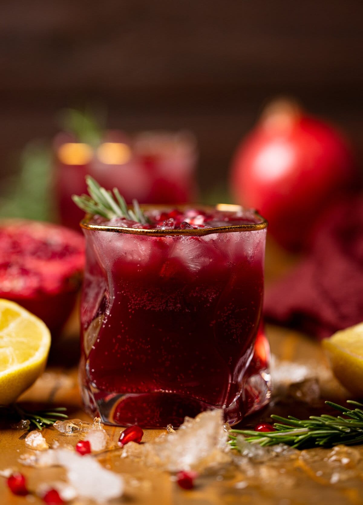 Holiday Pomegranate Ginger Mocktail in a gold-rimmed glass