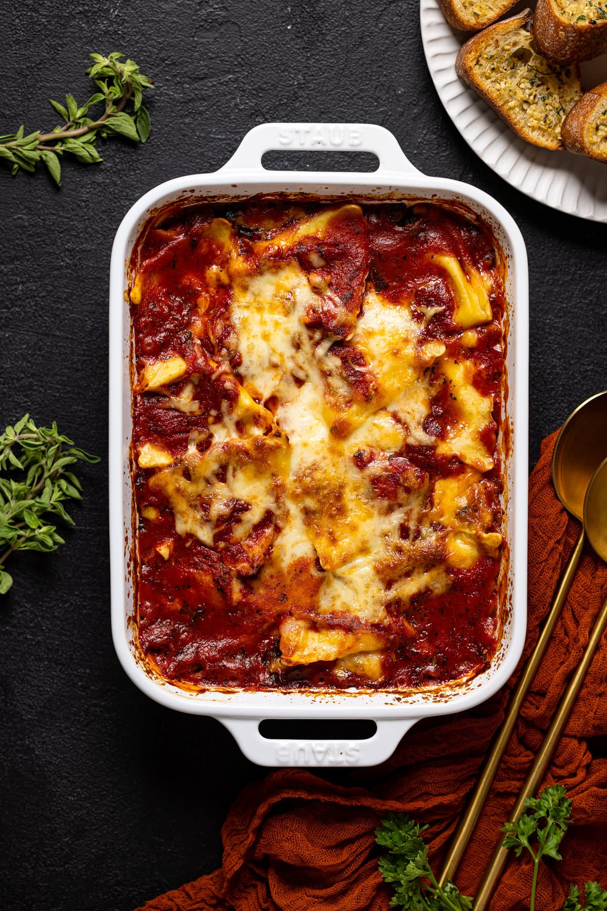 Pan of cooked Tomato Kale Ravioli Bake