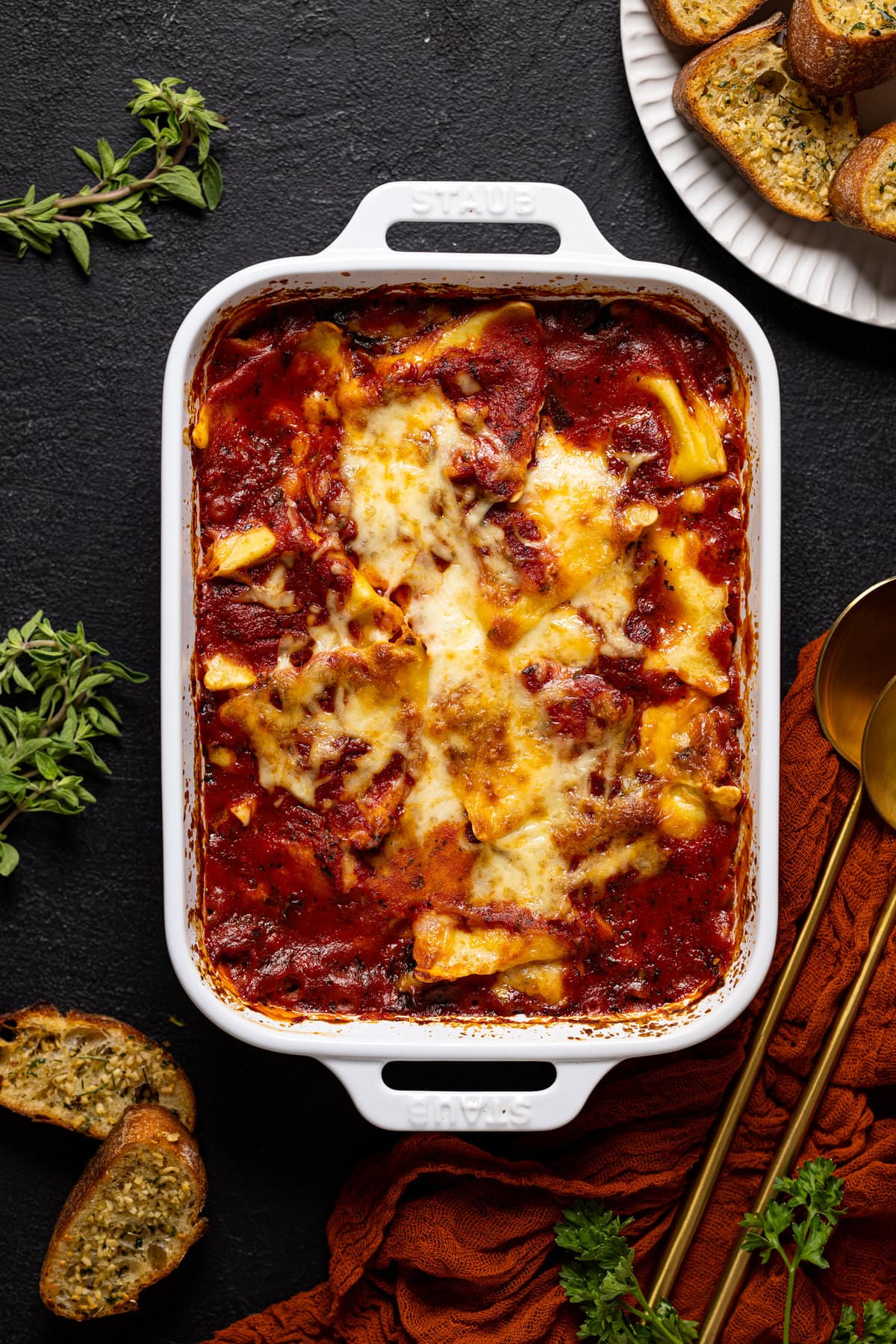 Pan of cooked Tomato Kale Ravioli Bake