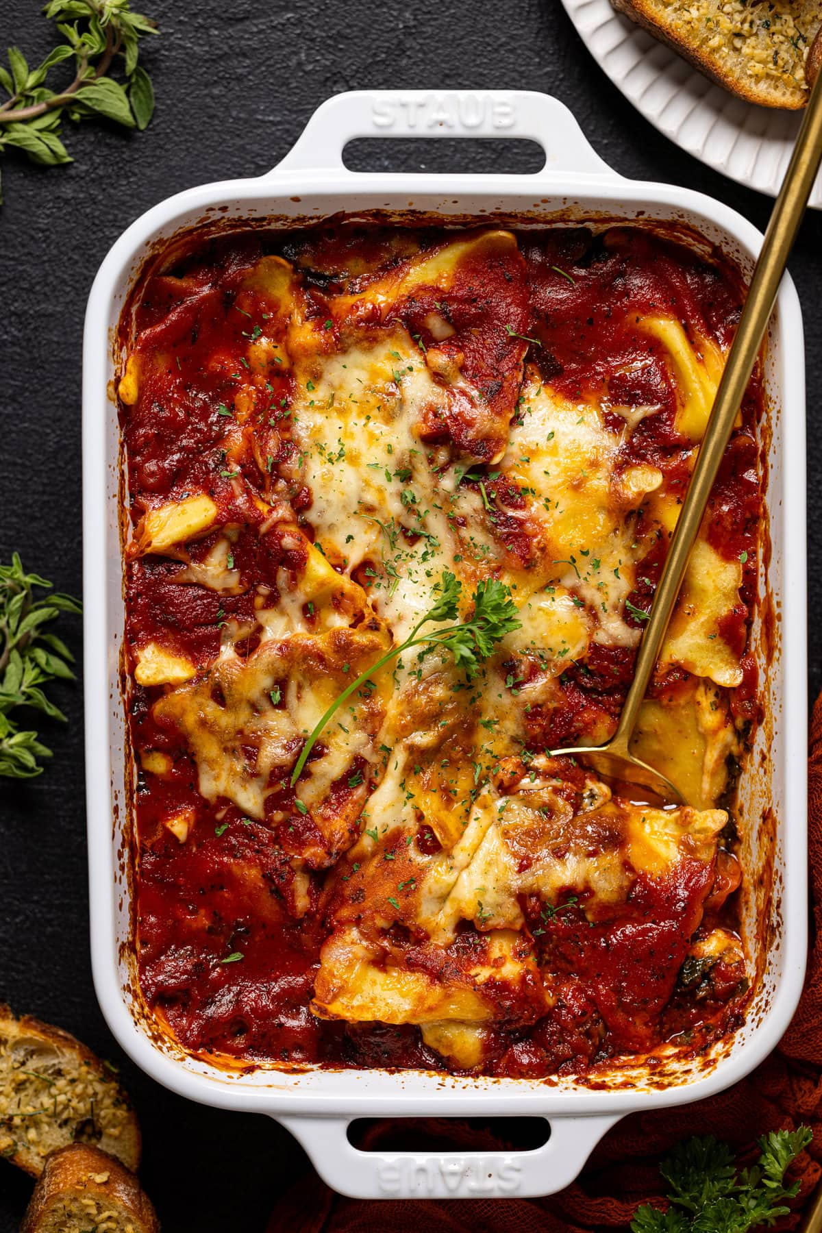 Pan of Tomato Kale Ravioli Bake. Part of the fall pasta recipes roundup. 