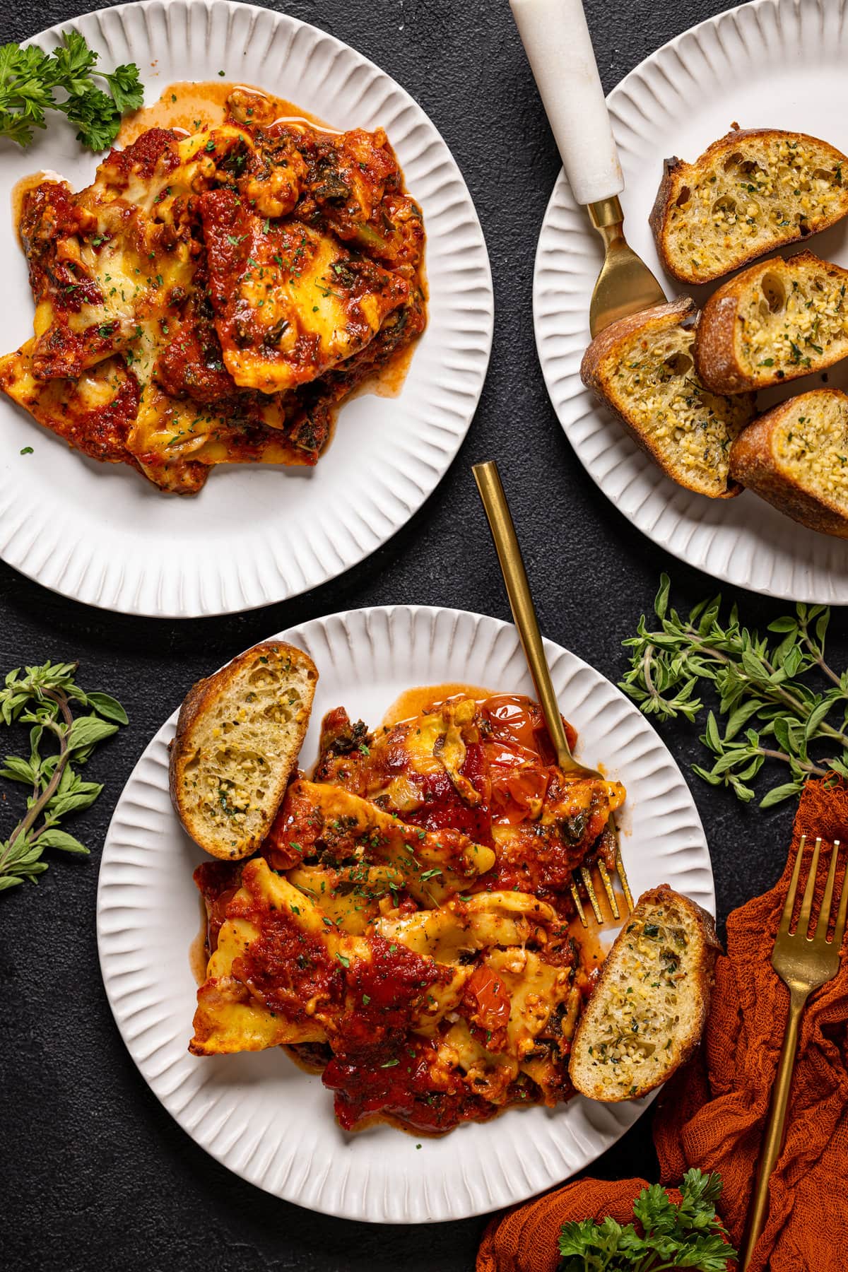 Two plates of Tomato Kale Ravioli Bake