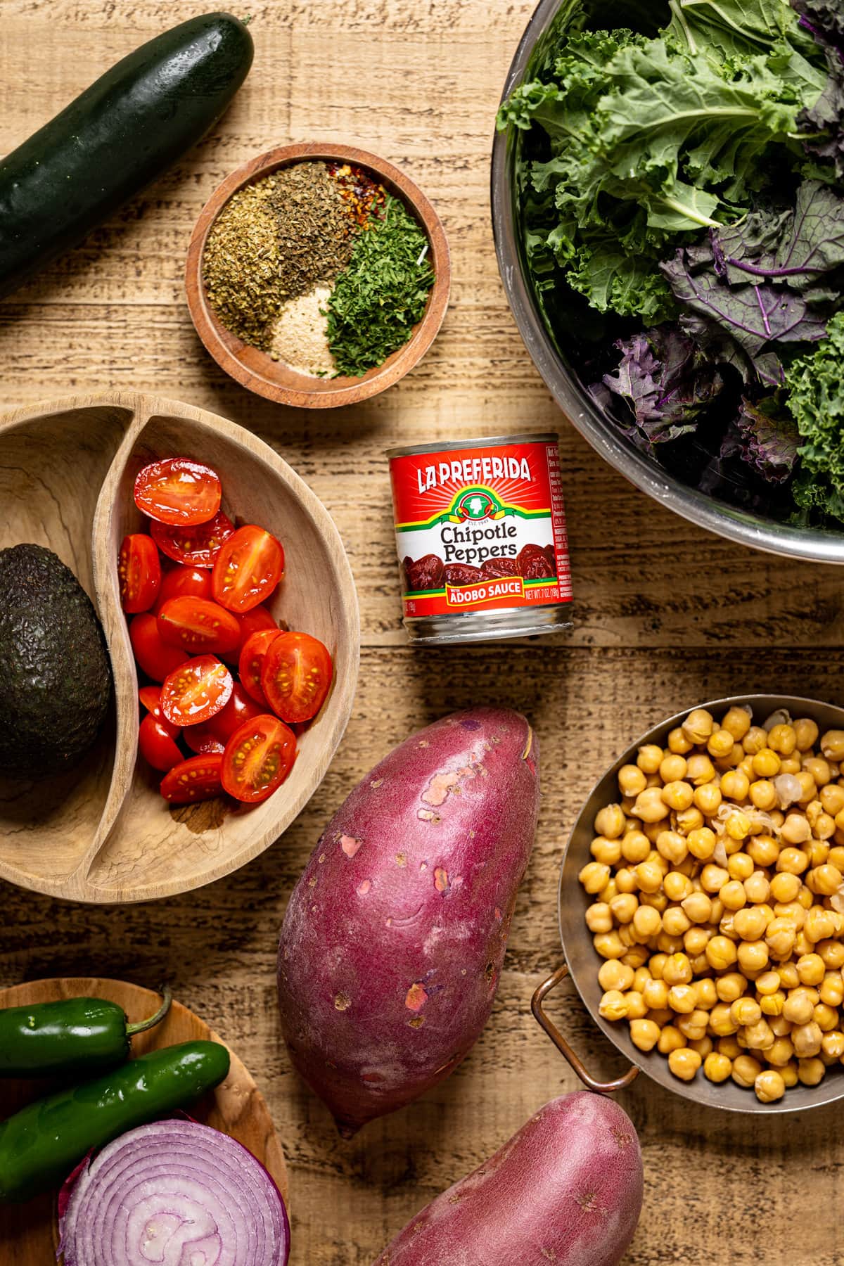 Ingredients for Spicy Chipotle Sweet Potato Chopped Salad including chickpeas, red onion, and avocado