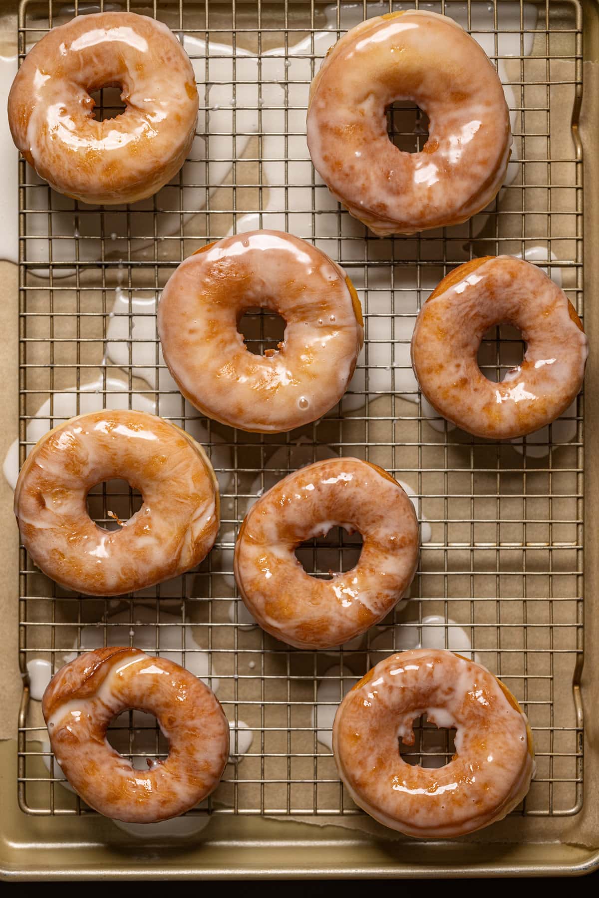 Homemade Classic Glazed Doughnuts on a wire rack
