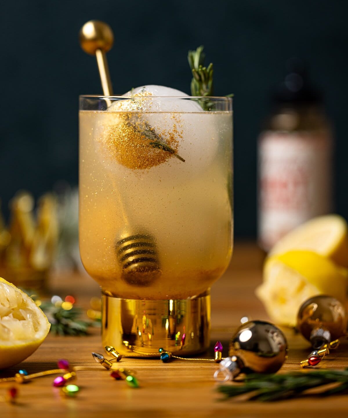 Glass of Hot Honey Lemon Mocktail with a honey dipper