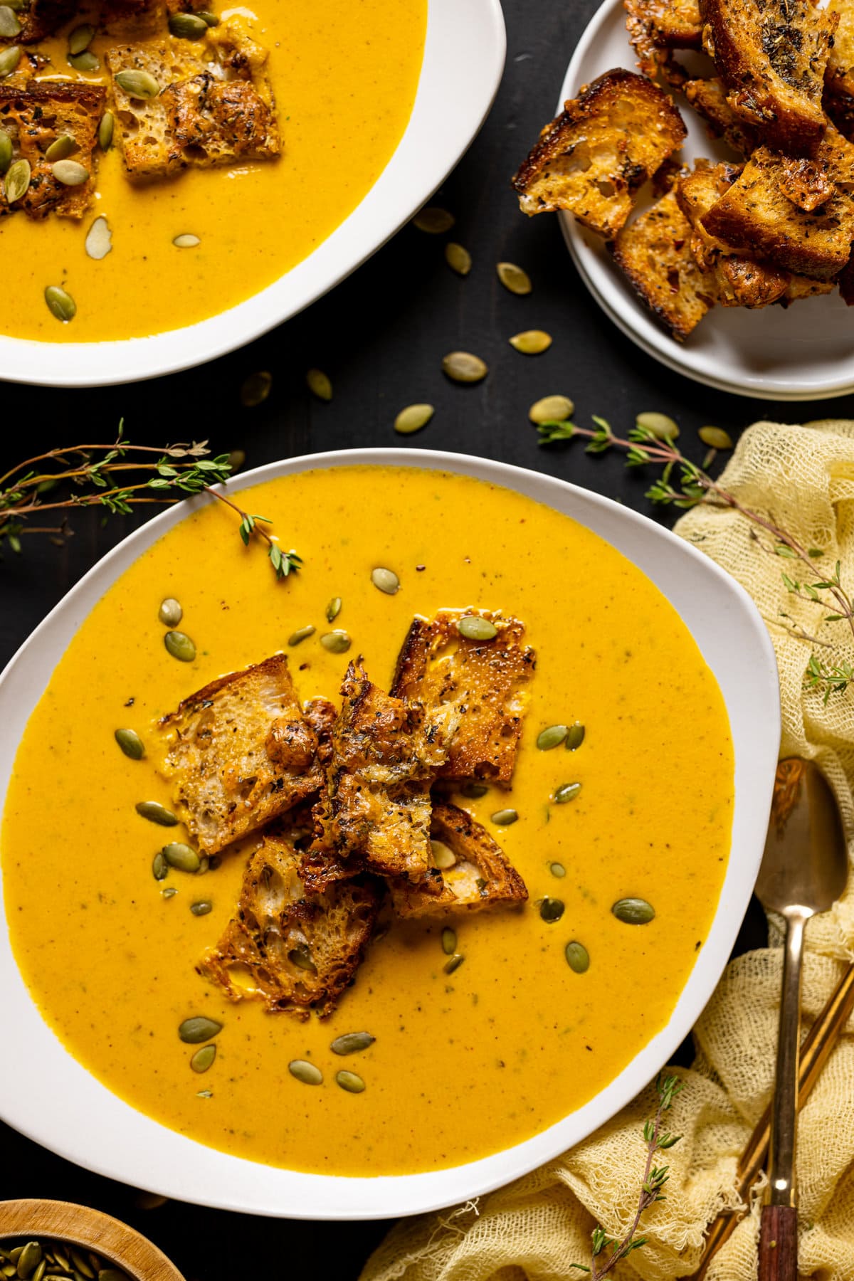 Closeup of Roasted Carrot Soup with Cheesy Croutons