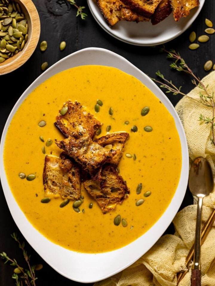 Bowl of Roasted Carrot Soup with Cheesy Croutons