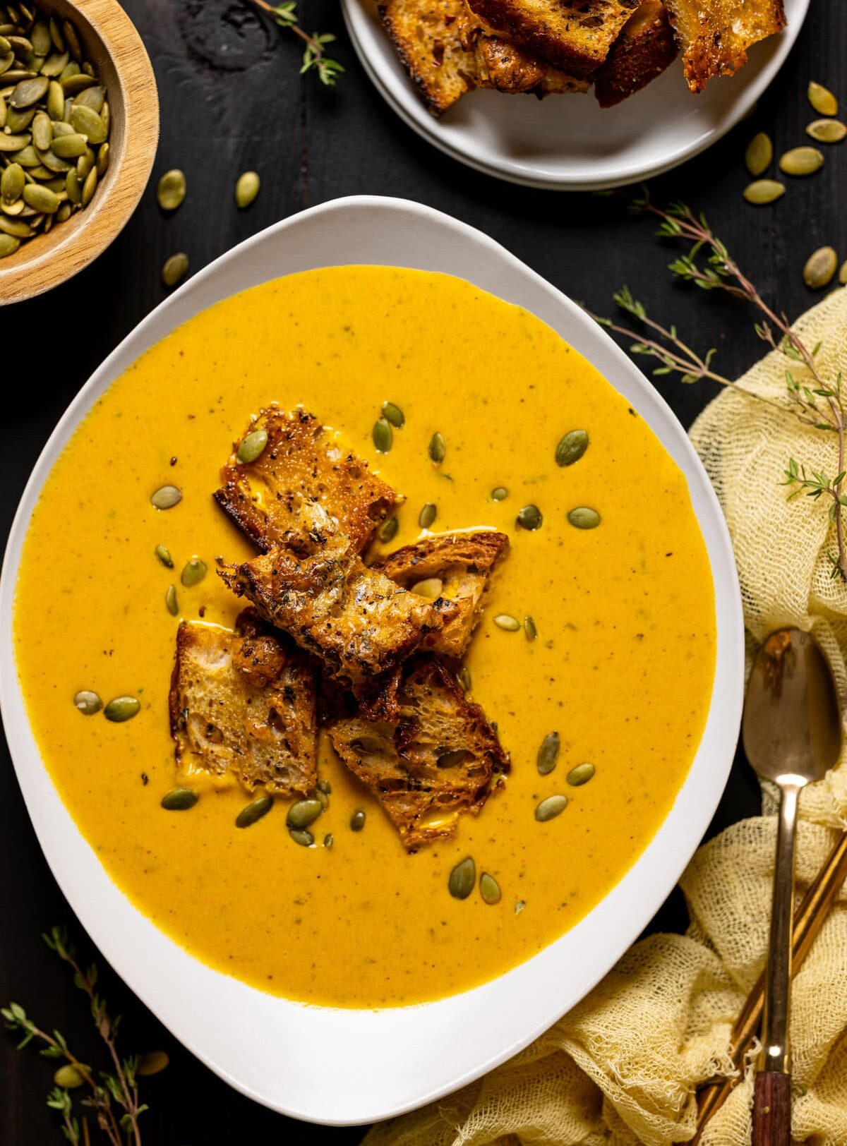 Bowl of Roasted Carrot Soup with Cheesy Croutons