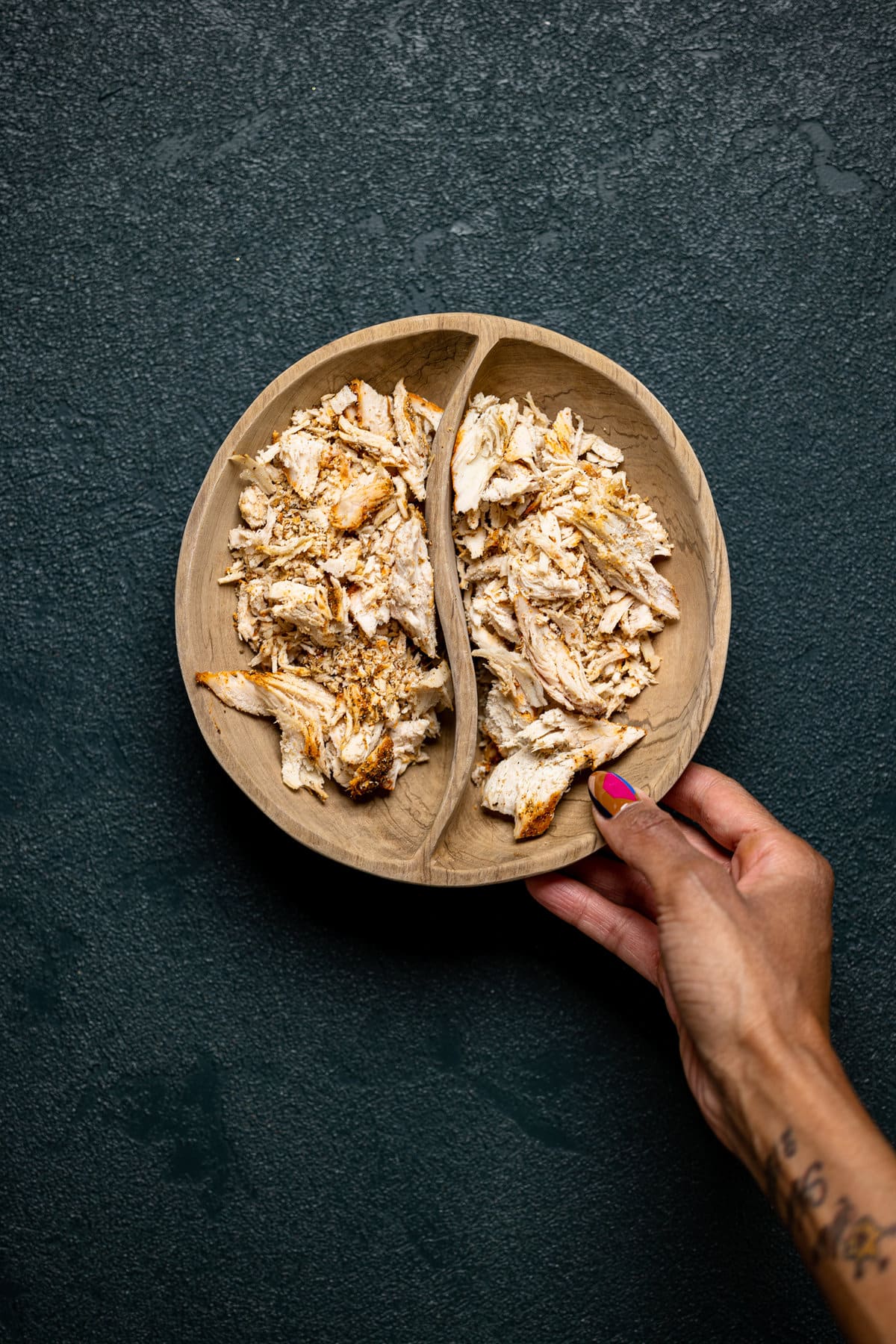 Shredded chicken in a wooden bowl