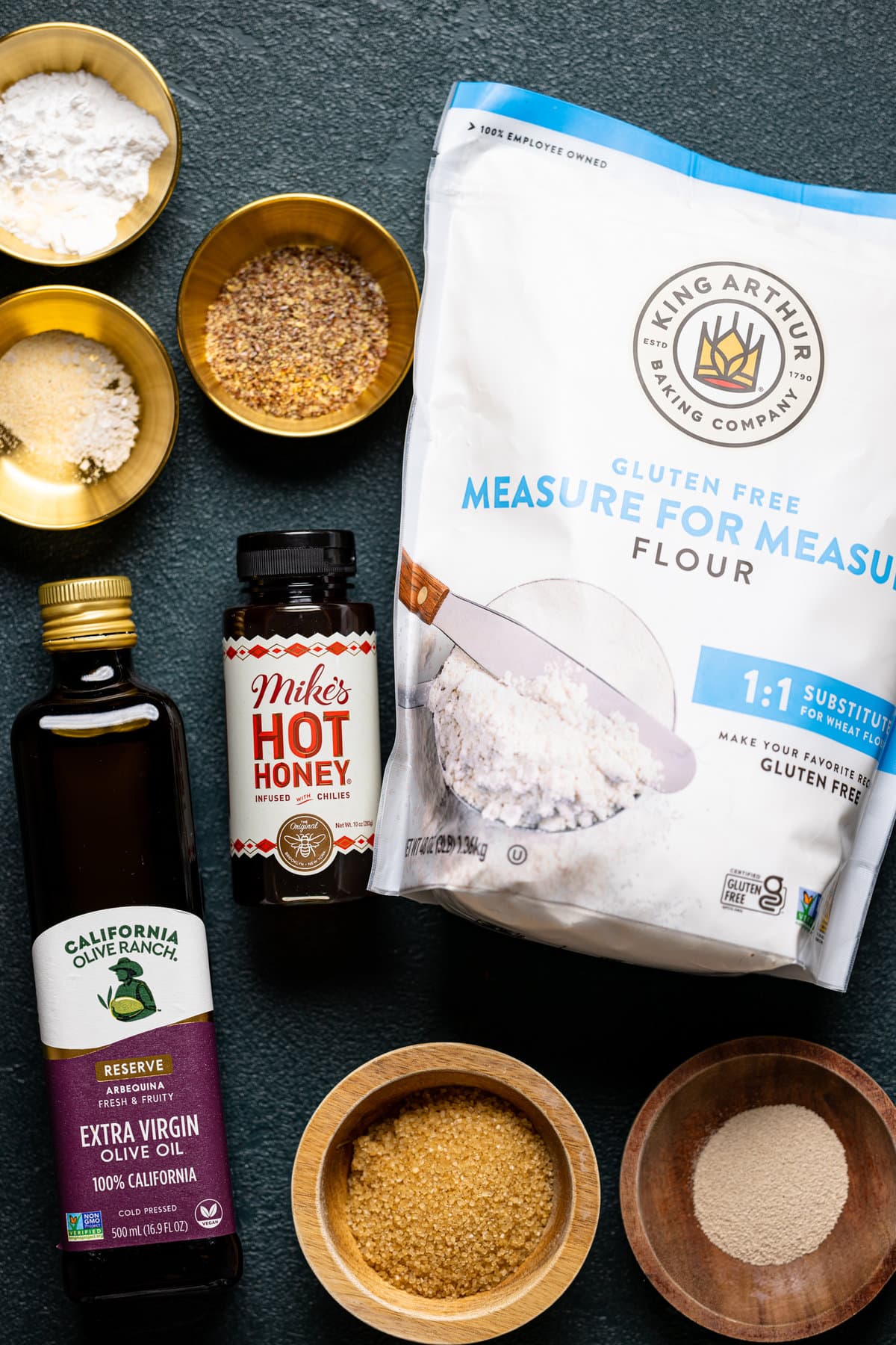 Ingredients for Gluten-Free Hot Honey Bacon Pizza including King Arthur\'s gluten-free flour, Mike\'s hot honey, and olive oil