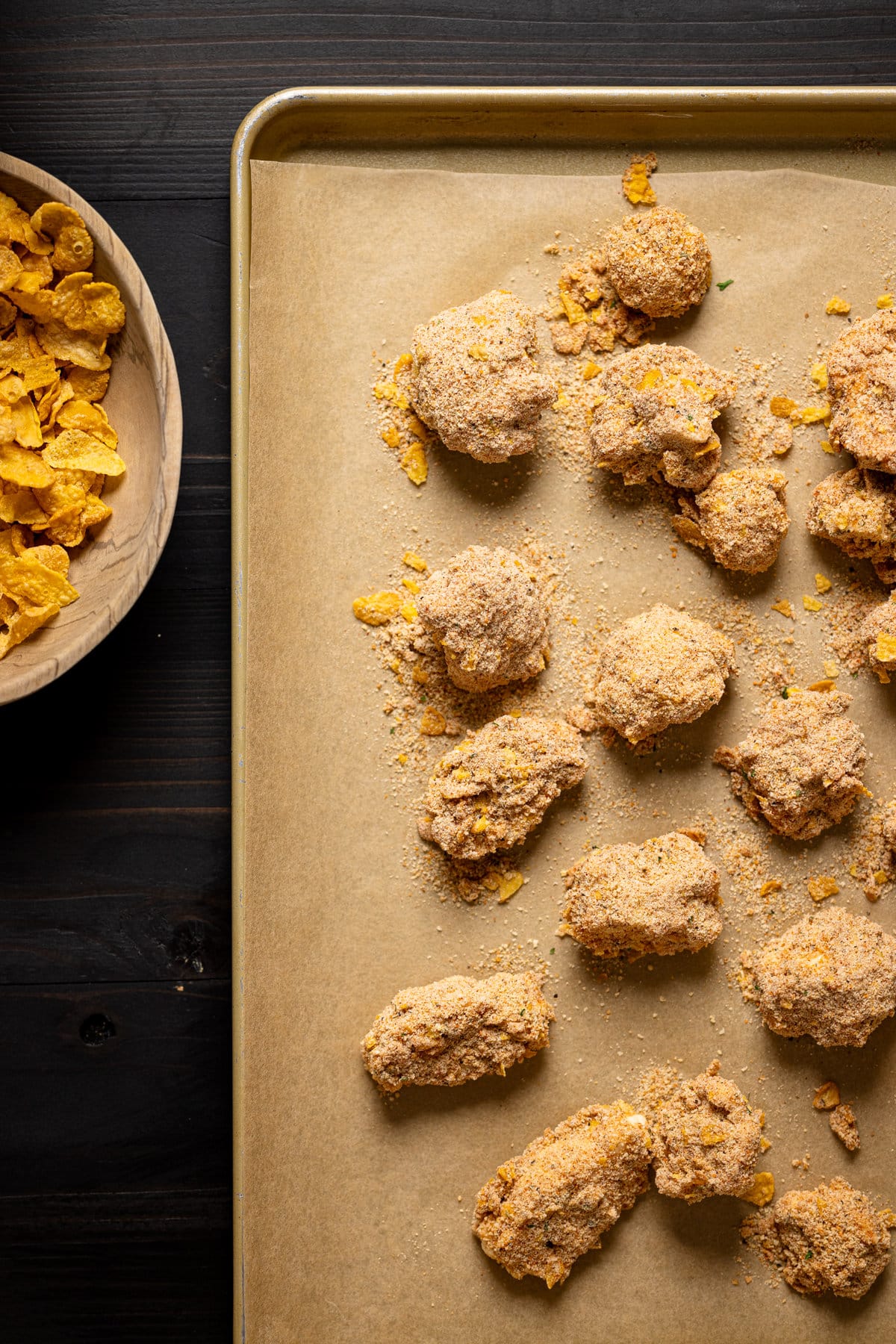 Breaded cauliflower bites on a baking sheet