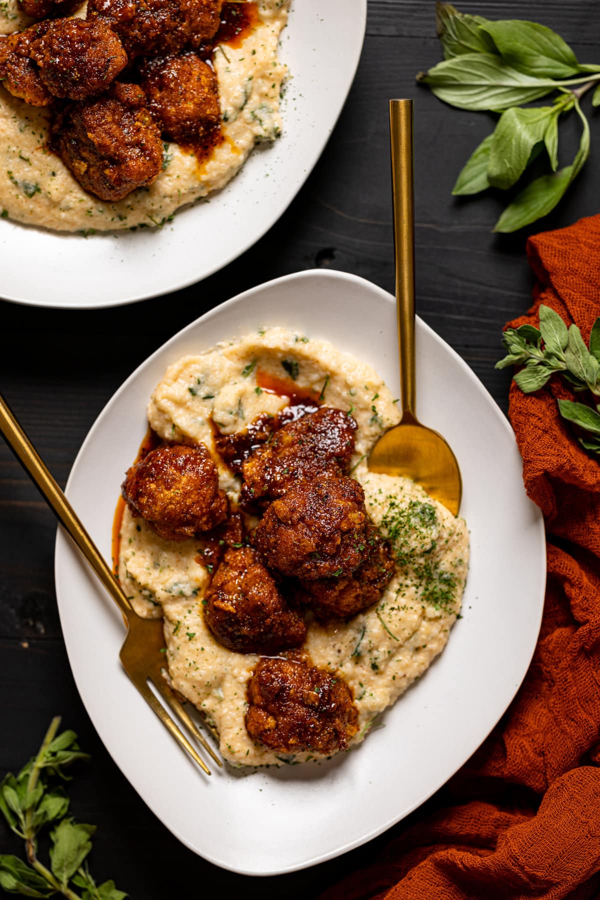 Overhead shot of a plate of Nashville Hot Cauliflower with Kale Grits