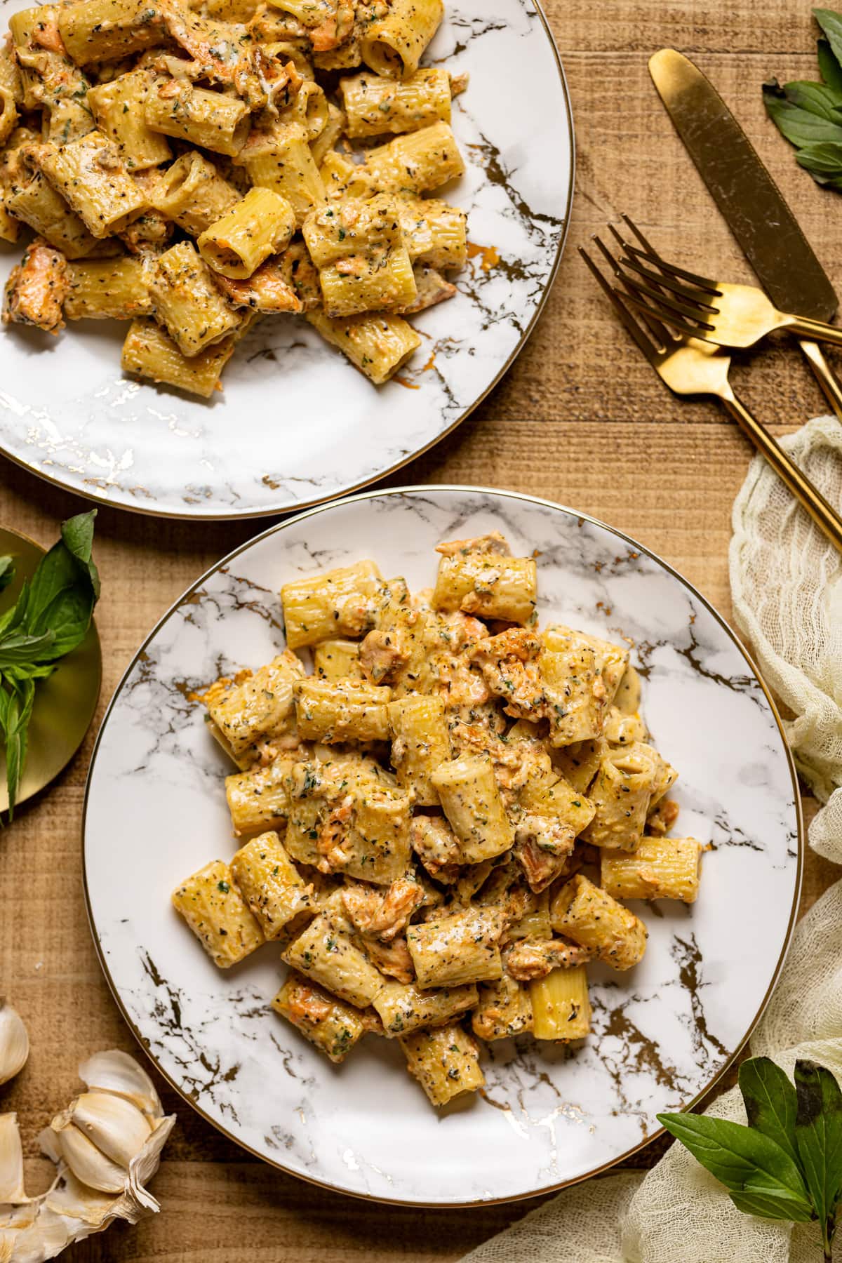 Two plates of Creamy Salmon Alfredo Pasta 