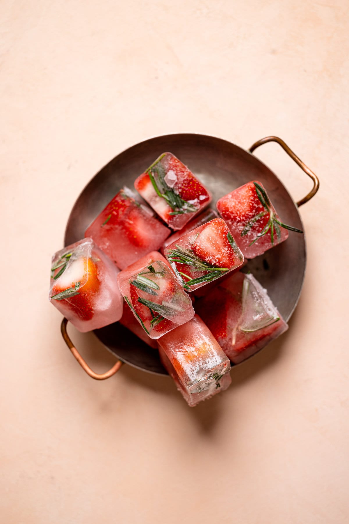 Pile of strawberry rosemary ice cubes