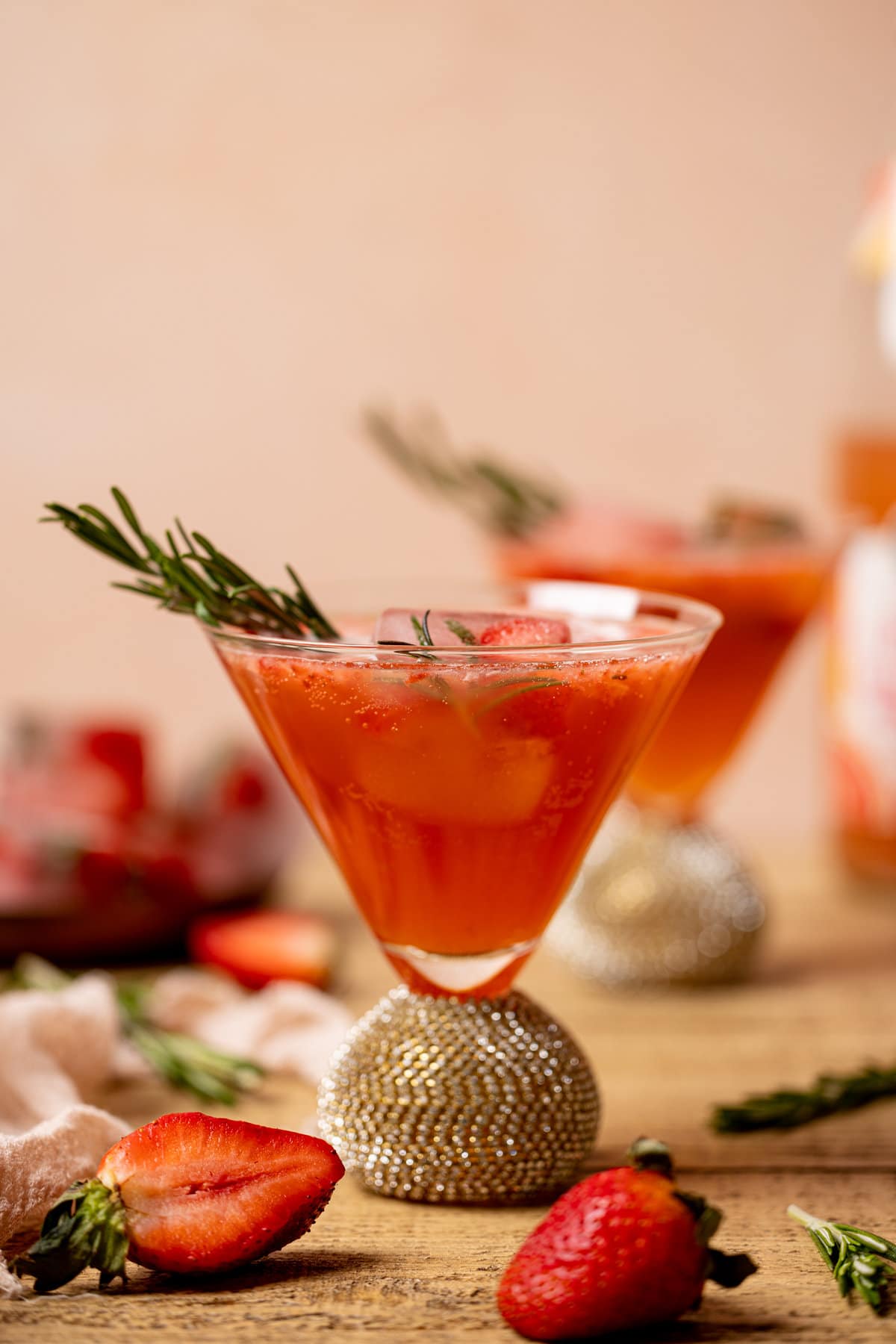 Two Strawberry Grapefruit Mocktails in jeweled cocktail glasses