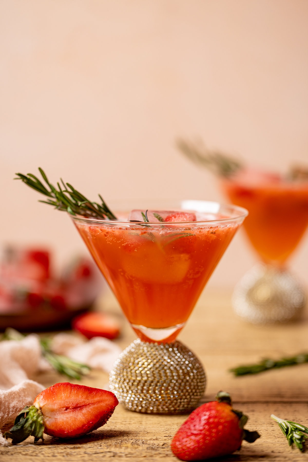 Two Strawberry Grapefruit Mocktails in jeweled cocktail glasses