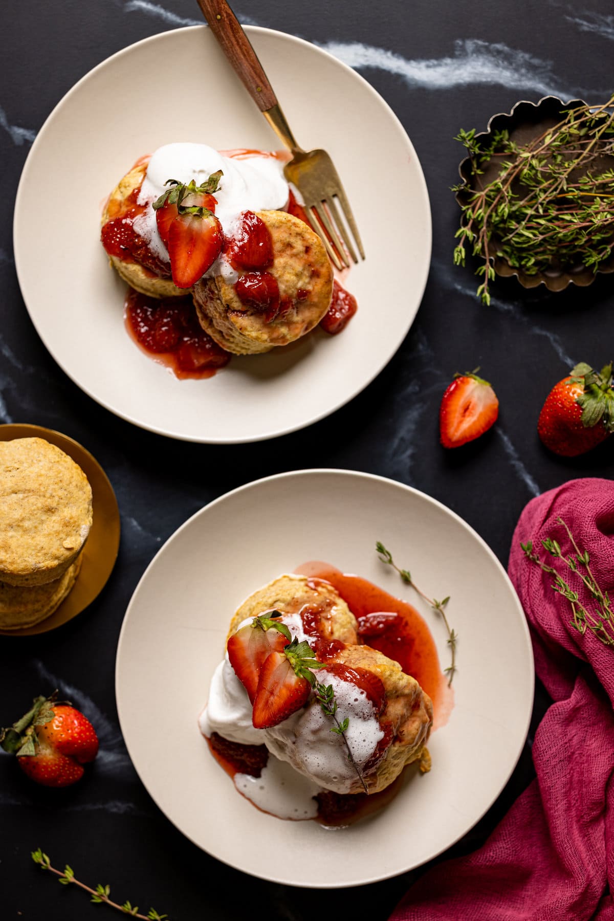 Overhead shot of two plates of Vegan Strawberry Shortcake