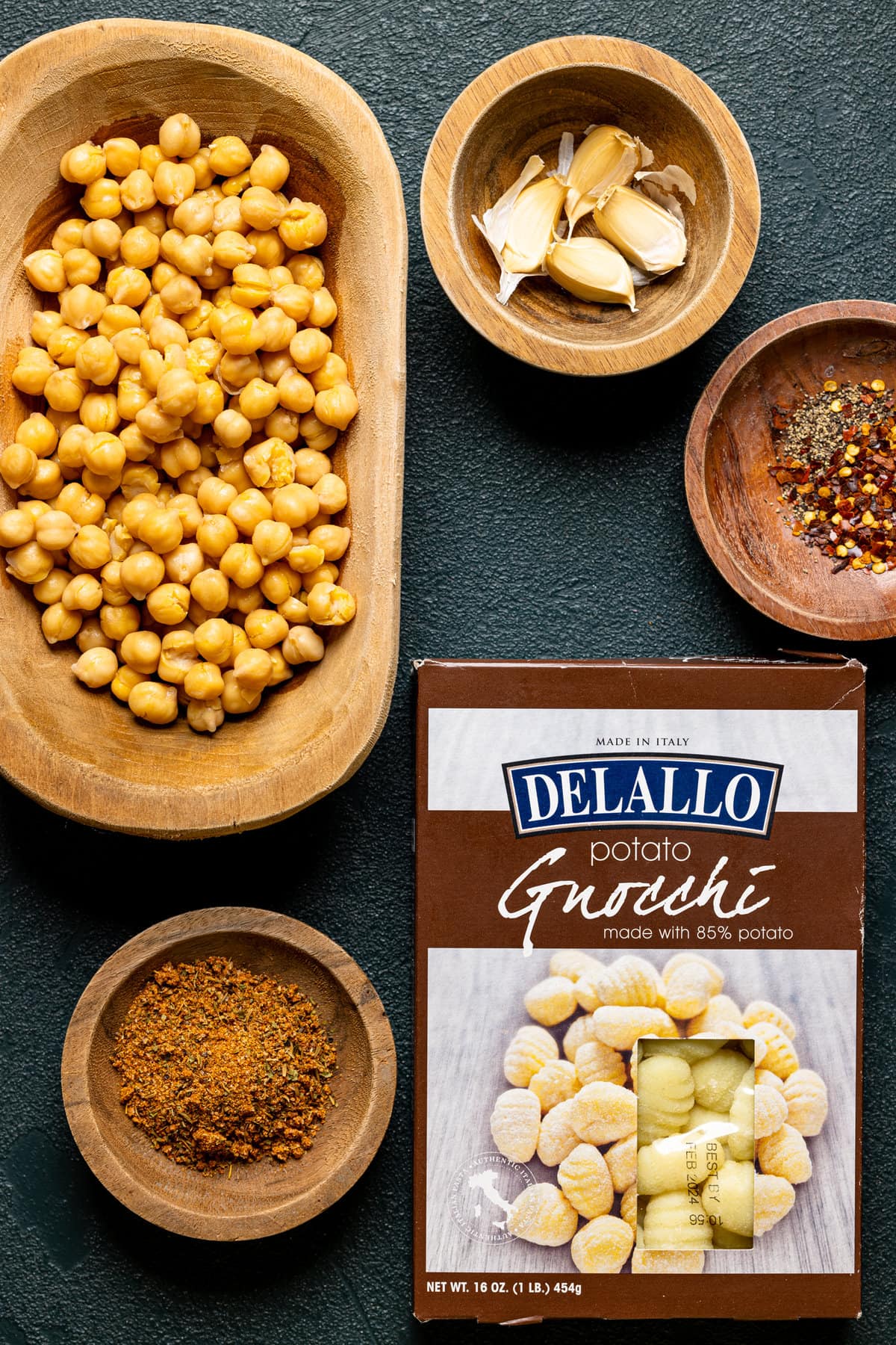 Ingredients for Weeknight Broccoli Pesto Gnocchi with Chickpeas including garlic, chickpeas, and spices