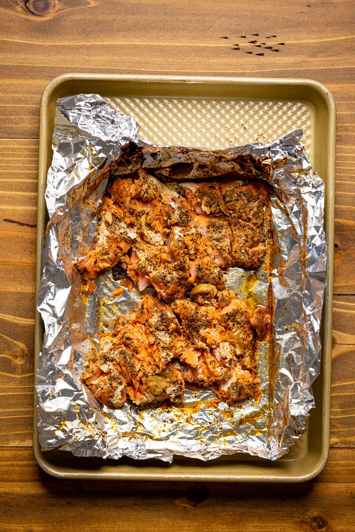 Seasoned salmon on aluminum foil