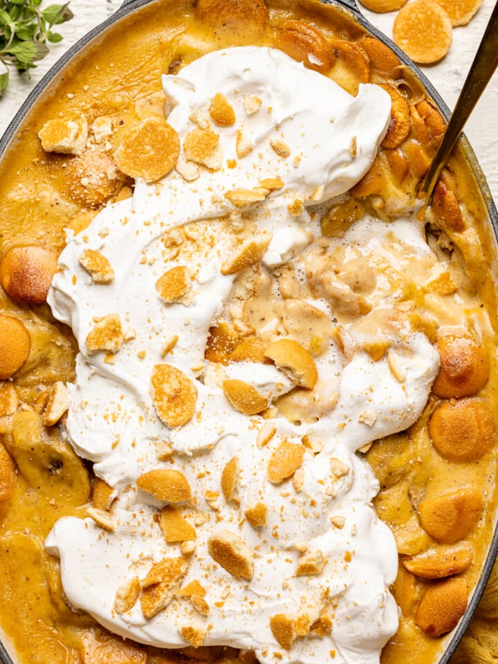 Overhead image of baked banana pudding with a spoon.