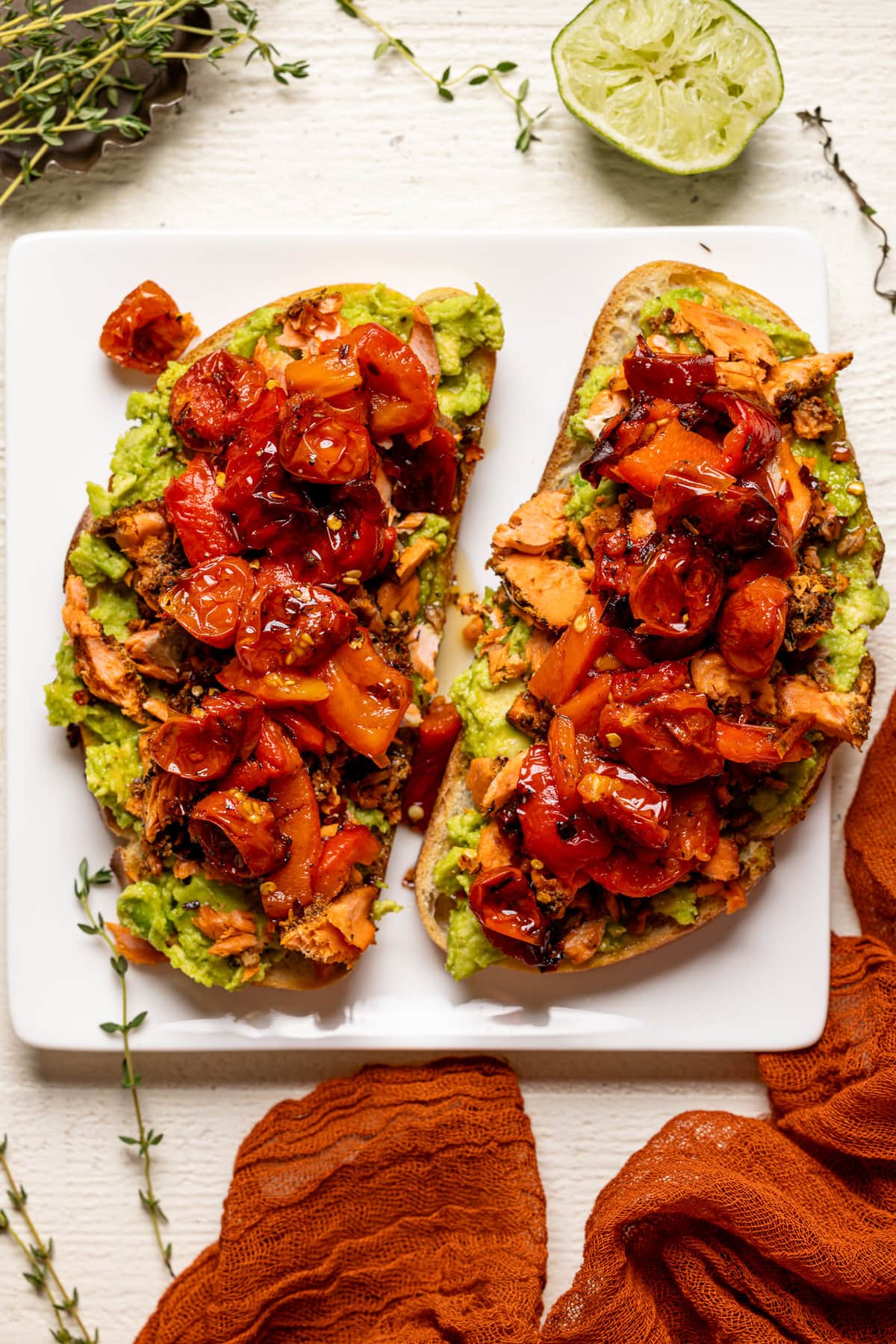 Two pieces of Jerk Salmon Avocado Toast on a plate