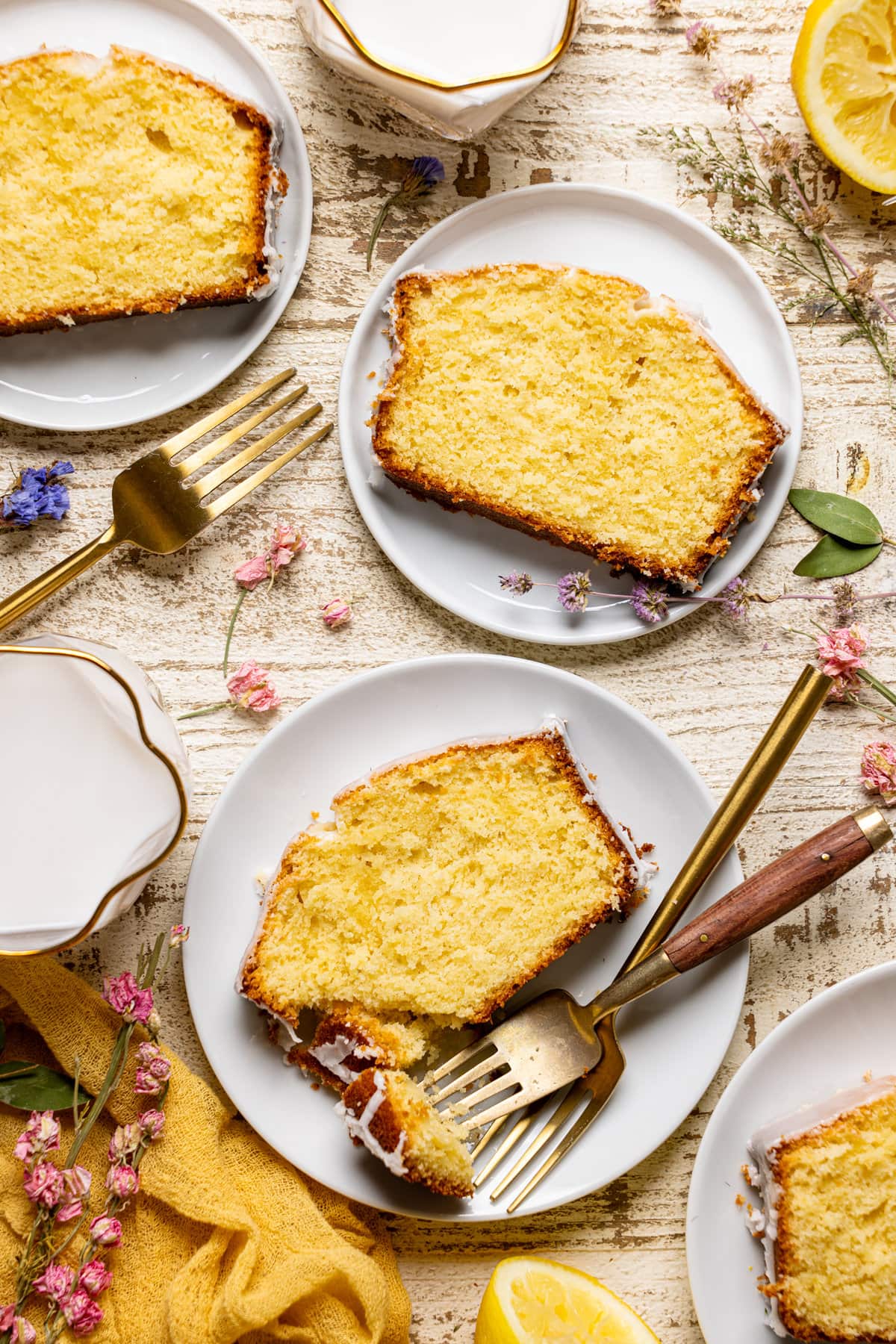 Overhead shot of slices of Iced Lemon Loaf Pound Cake with forks