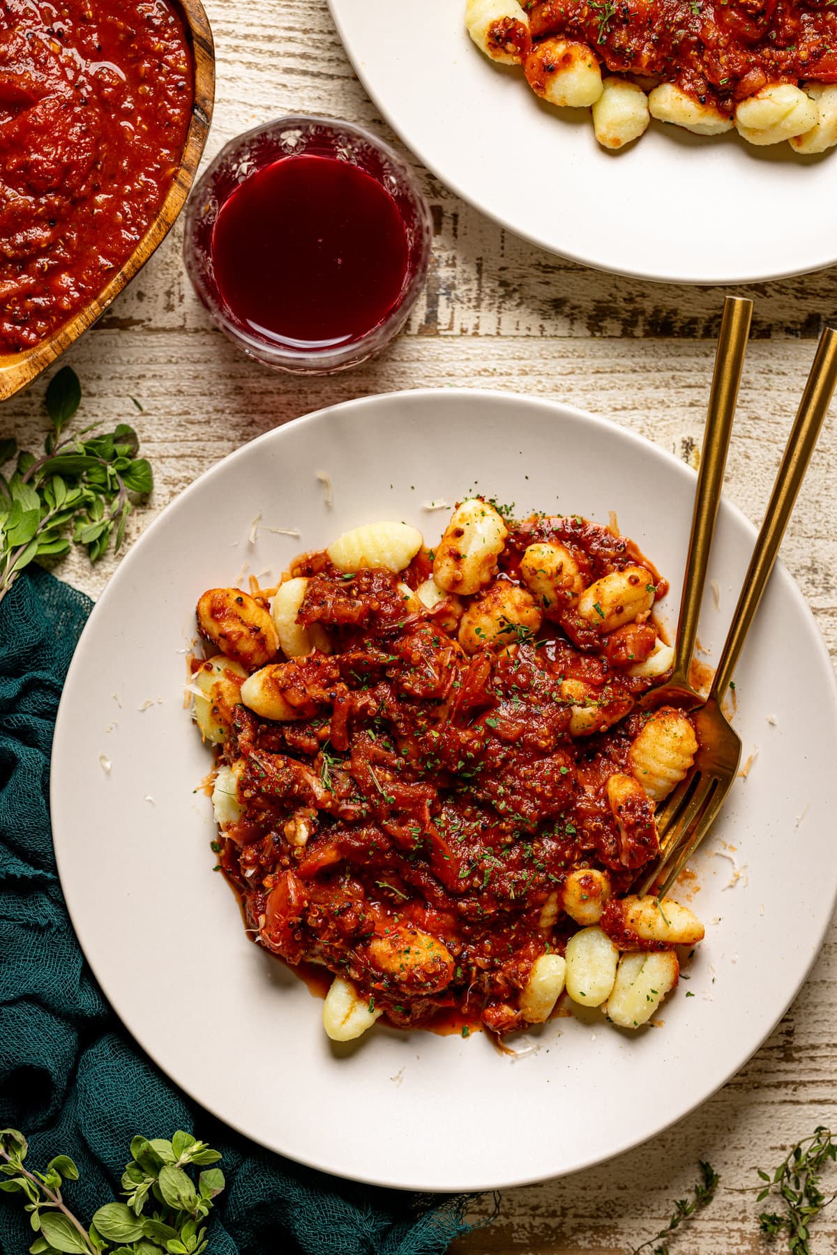 Overhead shot of a bowl of Vegan Meat Sauce on Gnocchi with forks