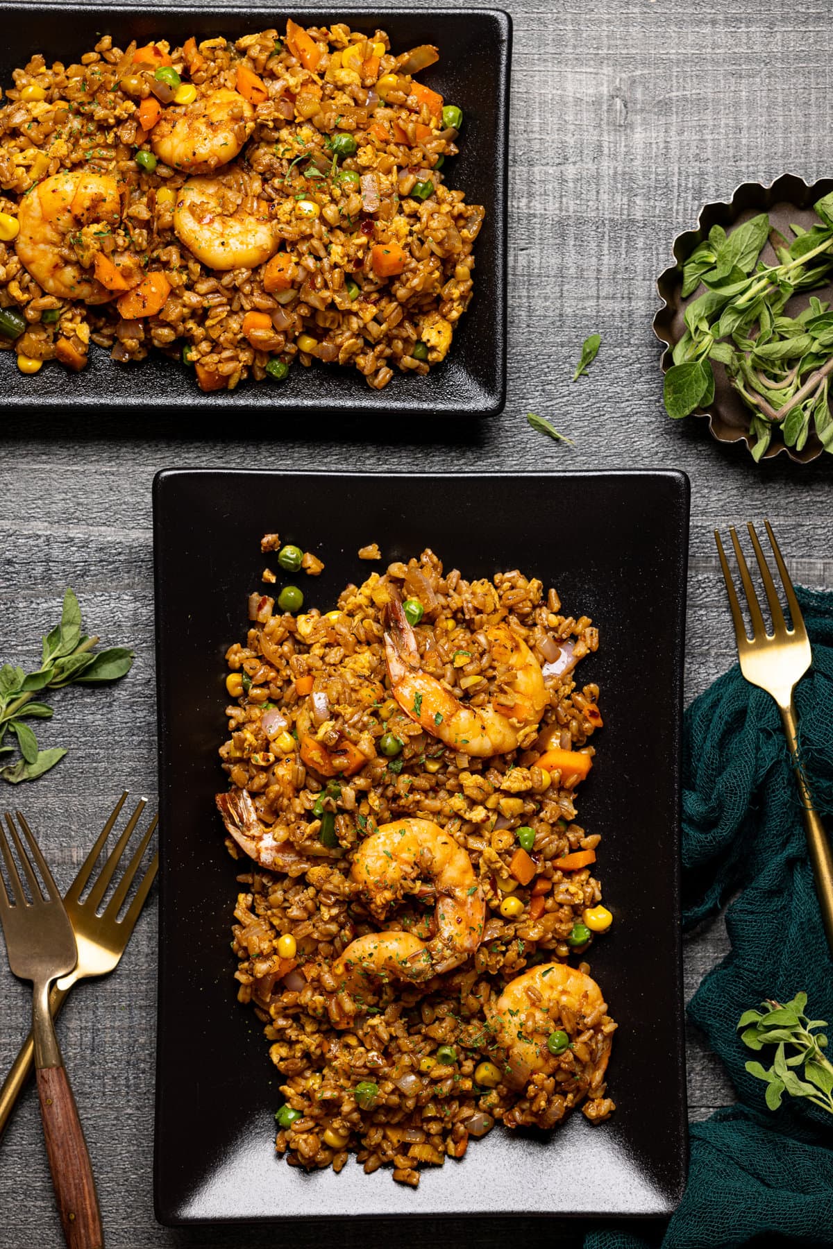 Overhead shot of Healthy Weeknight Shrimp Fried Rice on a black, rectangular plate