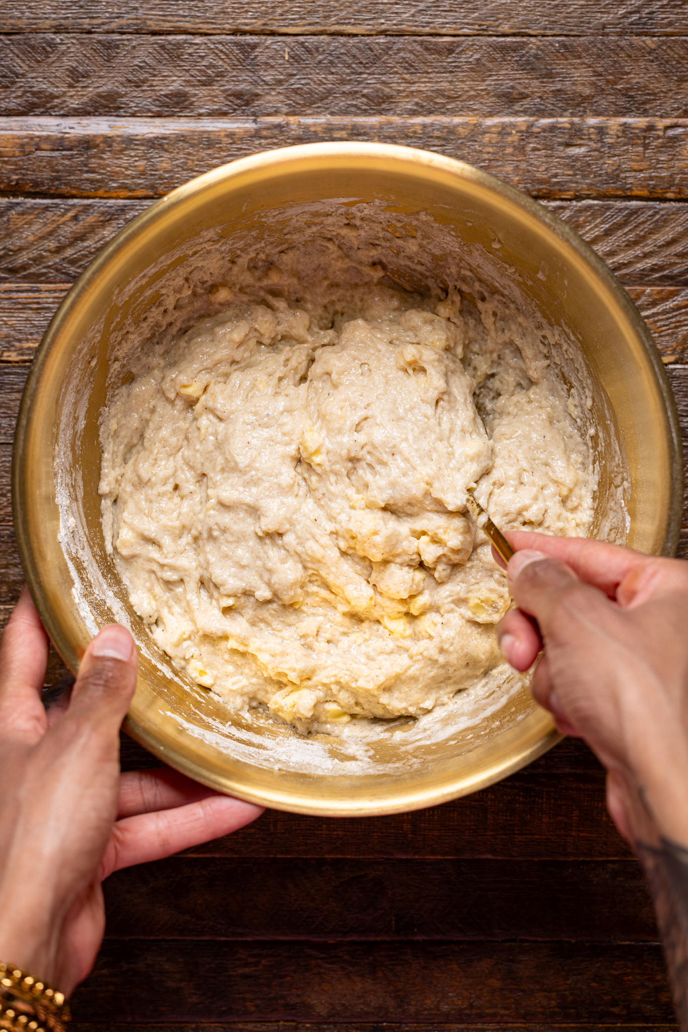 Image of biscuit topping in a bowl being stirred.