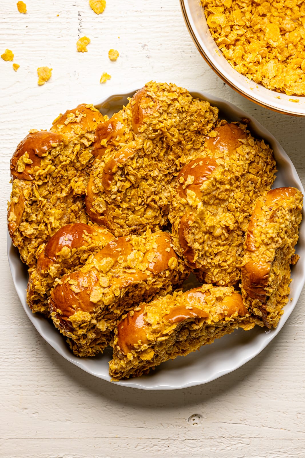 French toast in a white baking sheet with cornflakes. 