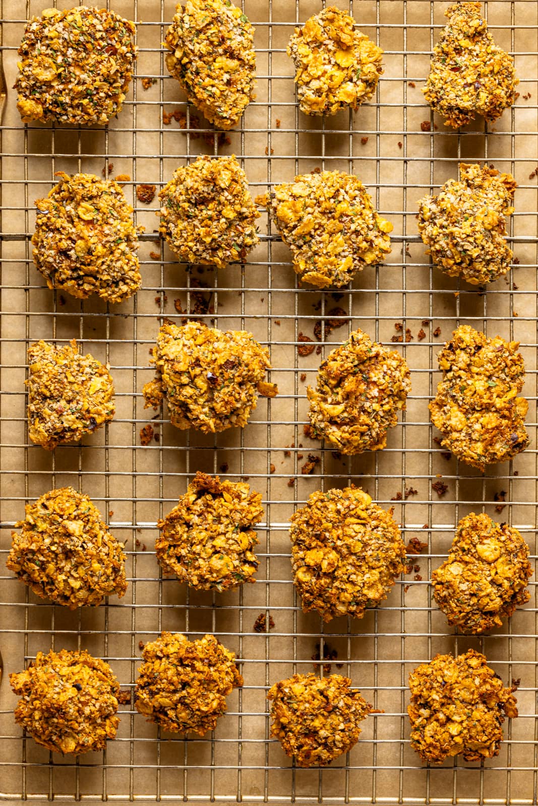 Popcorn chicken baked and lined on a baking sheet with a wire rack. 