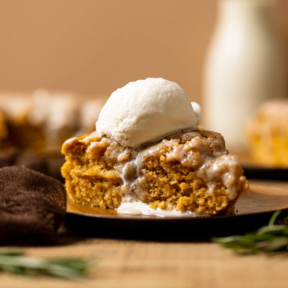 Sliced cake with a scoop of ice cream on top.