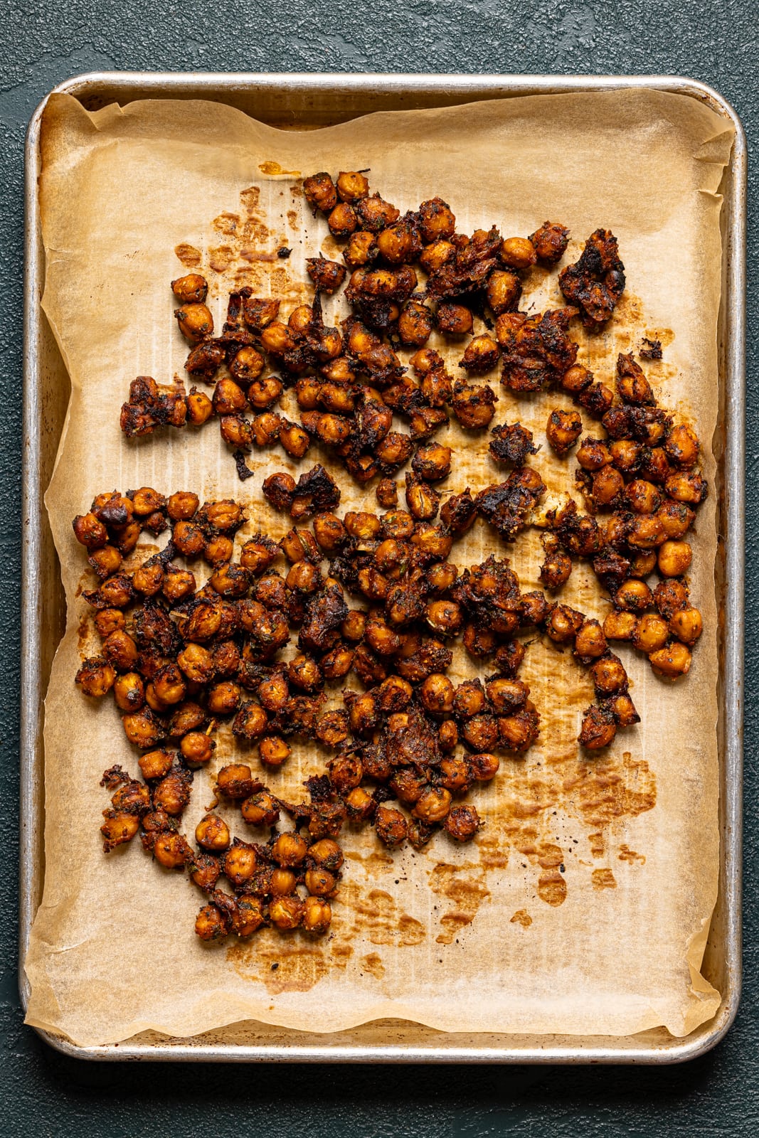 BBQ roasted chickpeas on a baking sheet with parchment paper.