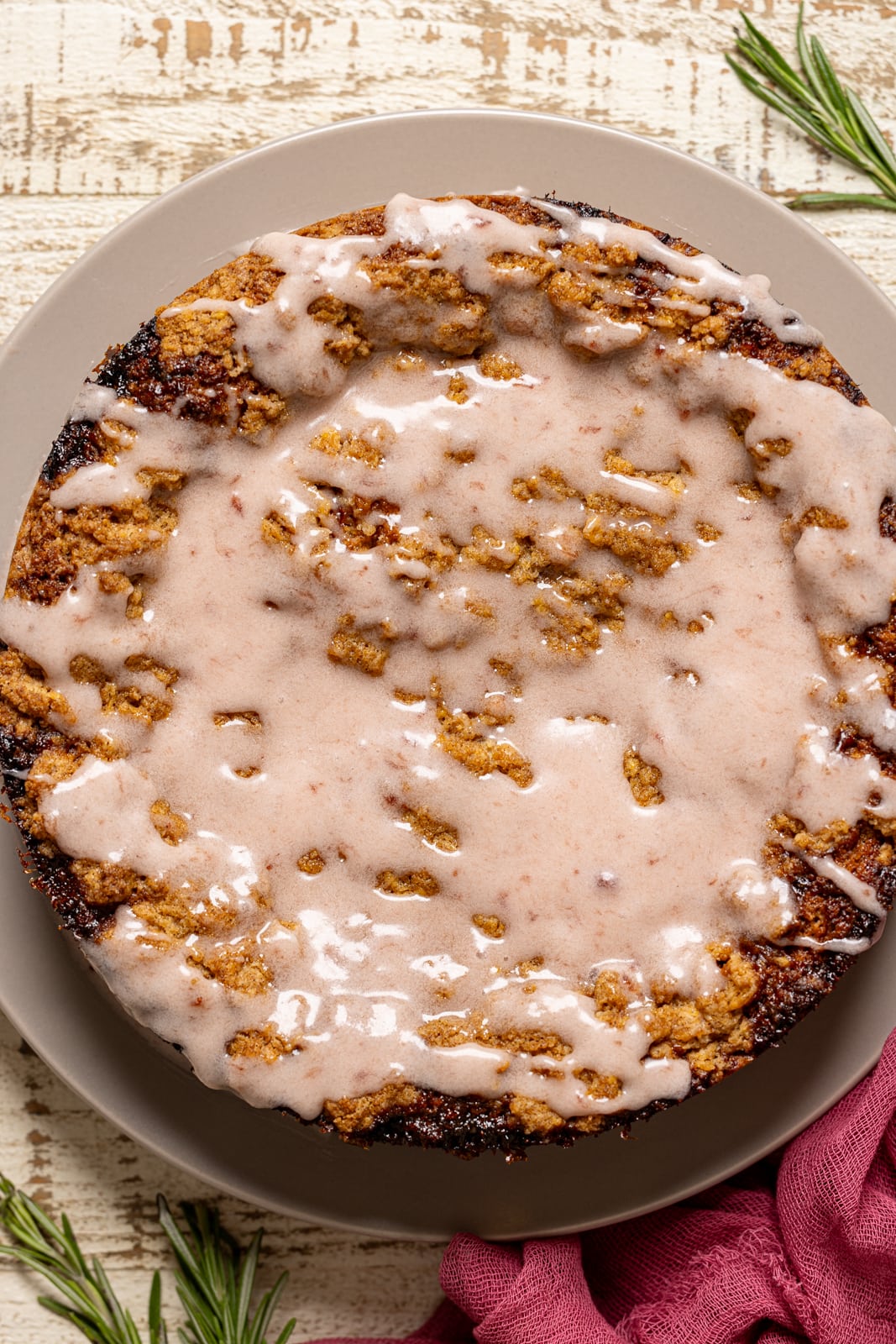 Up close shot of strawberry crumb cake with strawberry glaze. 