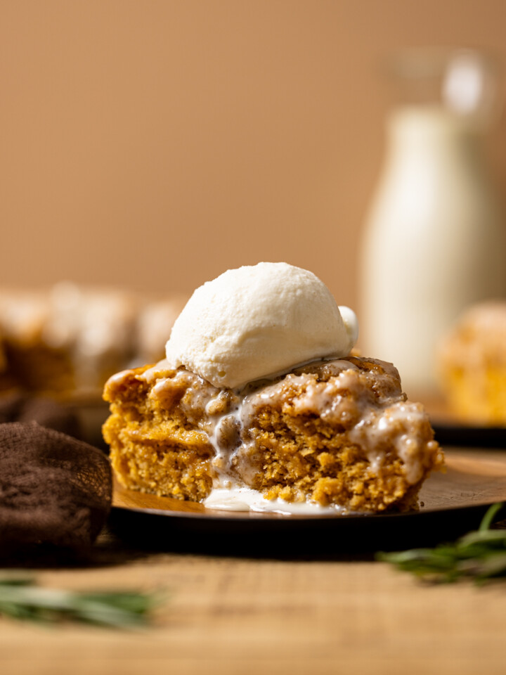 Sliced cake with a scoop of ice cream on top.