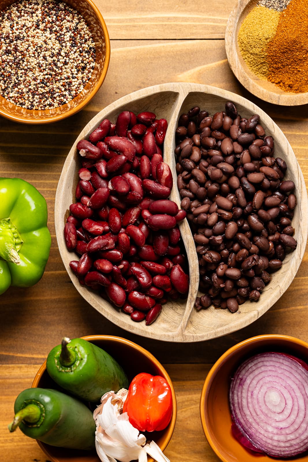 Ingredients including beans, quinoa, peppers, onions, and seasonings.