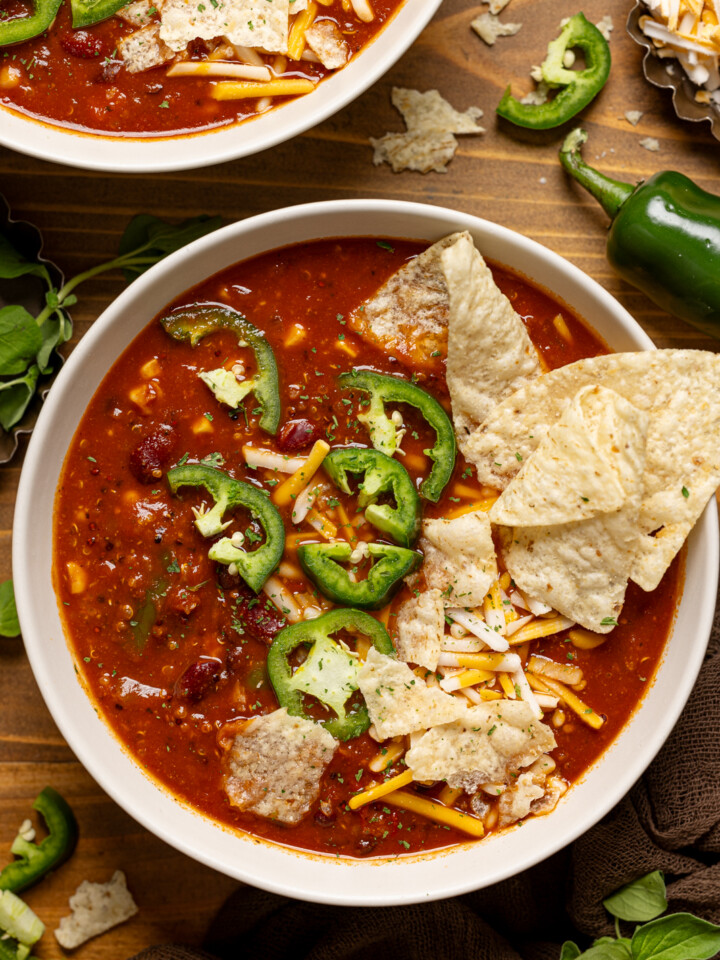 Up close shot of bowl of soup with tortilla chips and jalapeños.