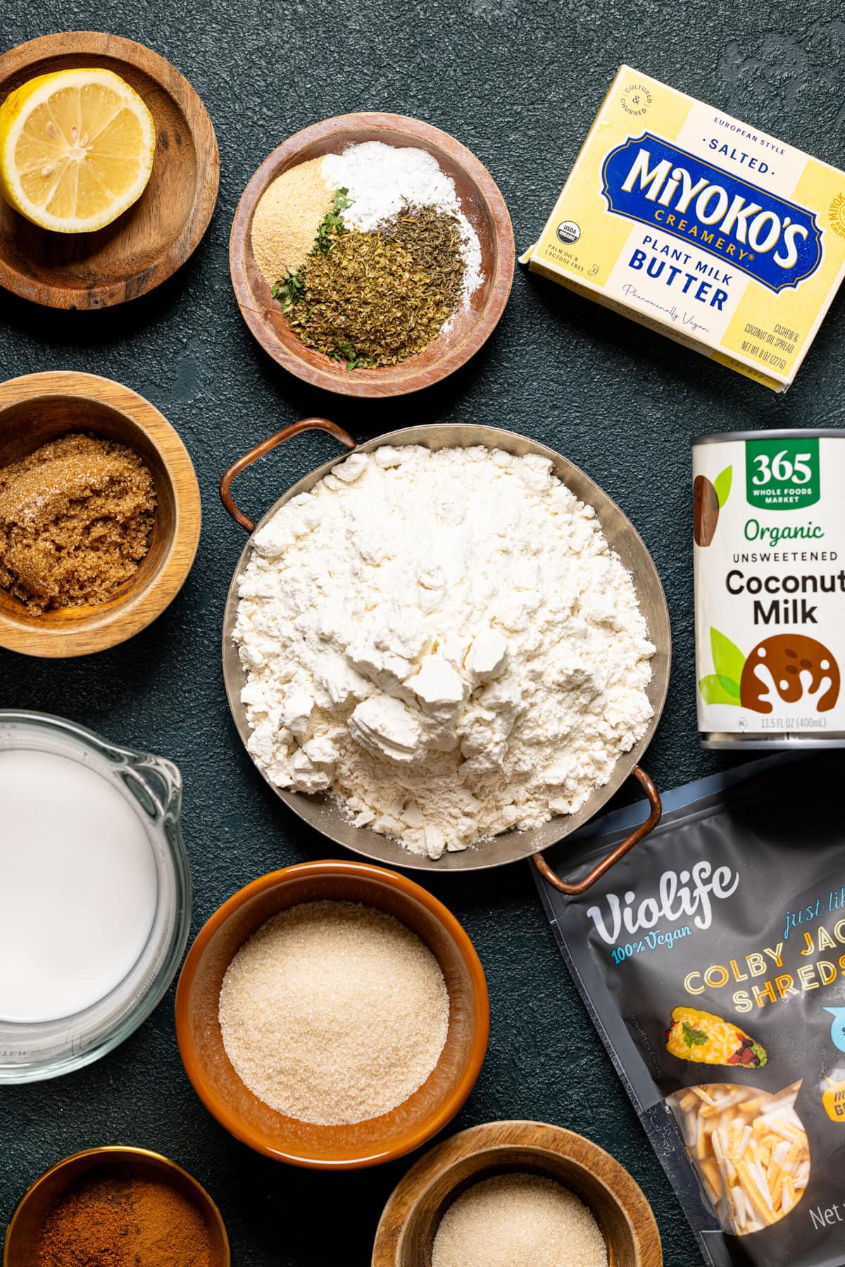 Ingredients on a dark green table.