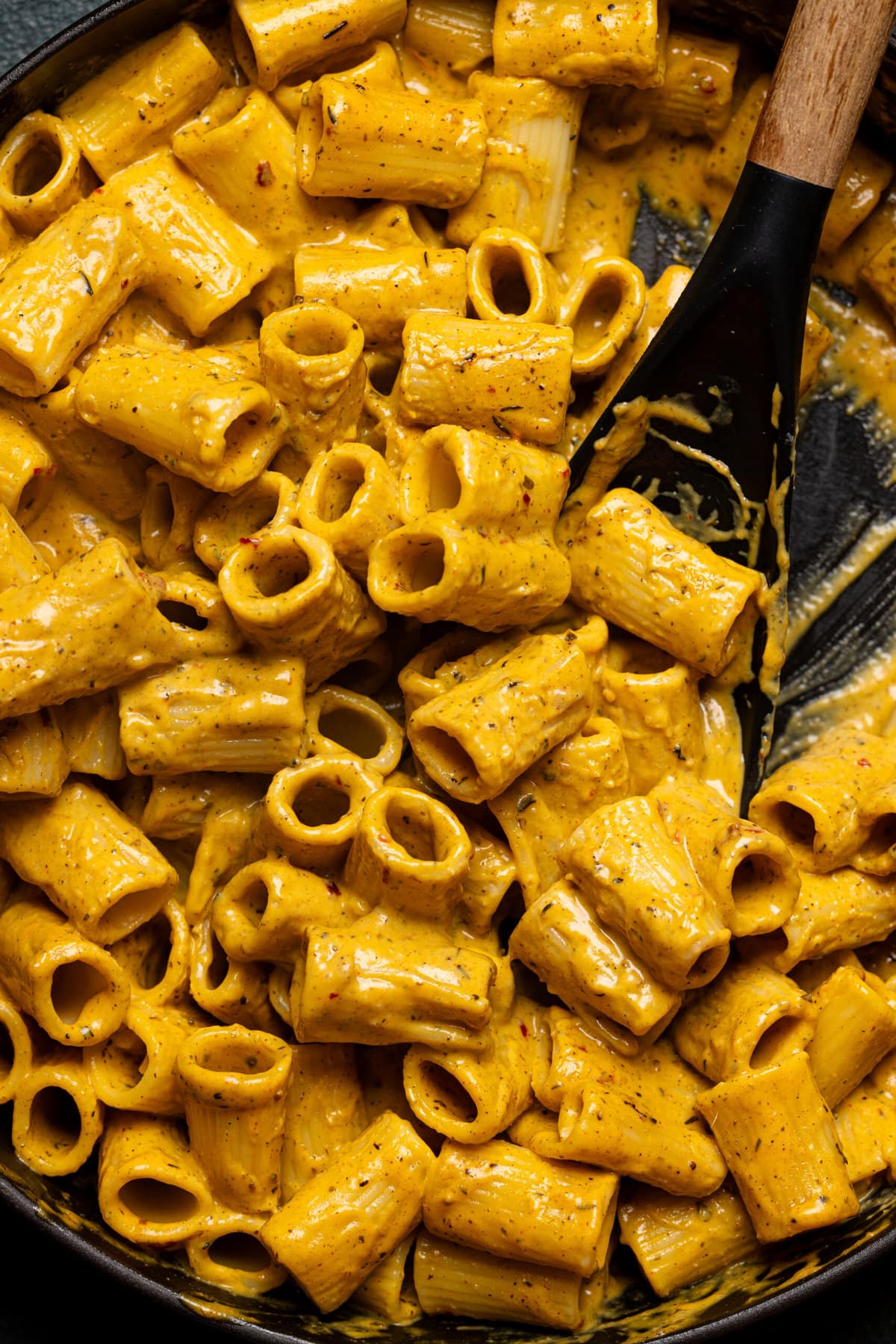 Up close shot of creamy butternut squash pasta in a skillet. 