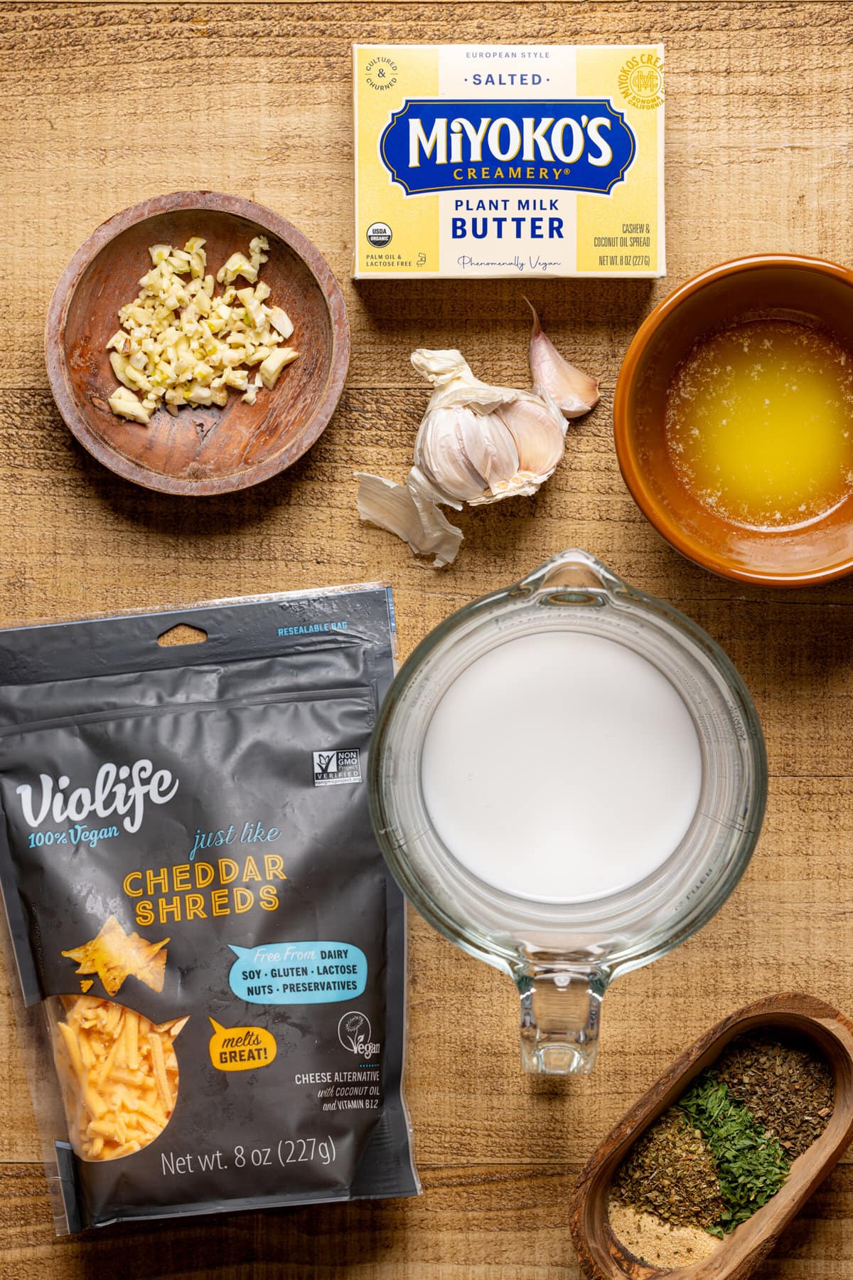 Ingredients on a white brown wood table.