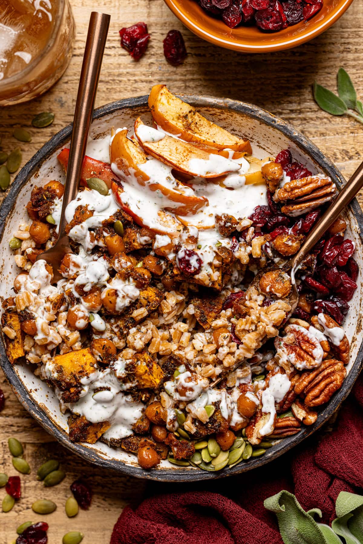 Fall Harvest Bowl with two spoons and side of juice.