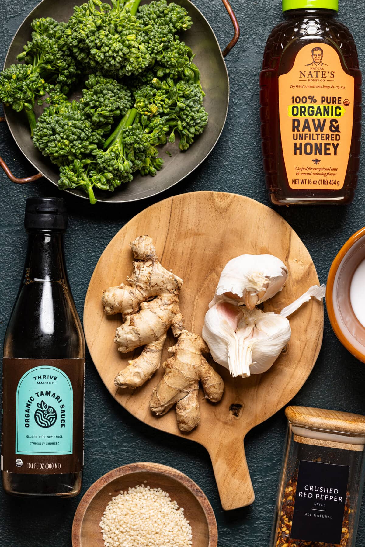 Ingredients on a dark green table.