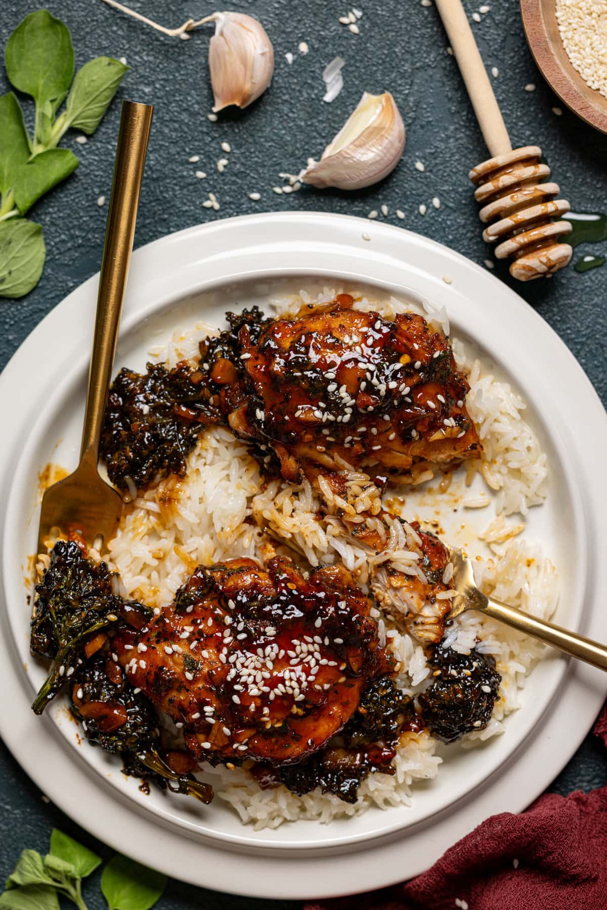 Chicken and rice in a plate with two forks.